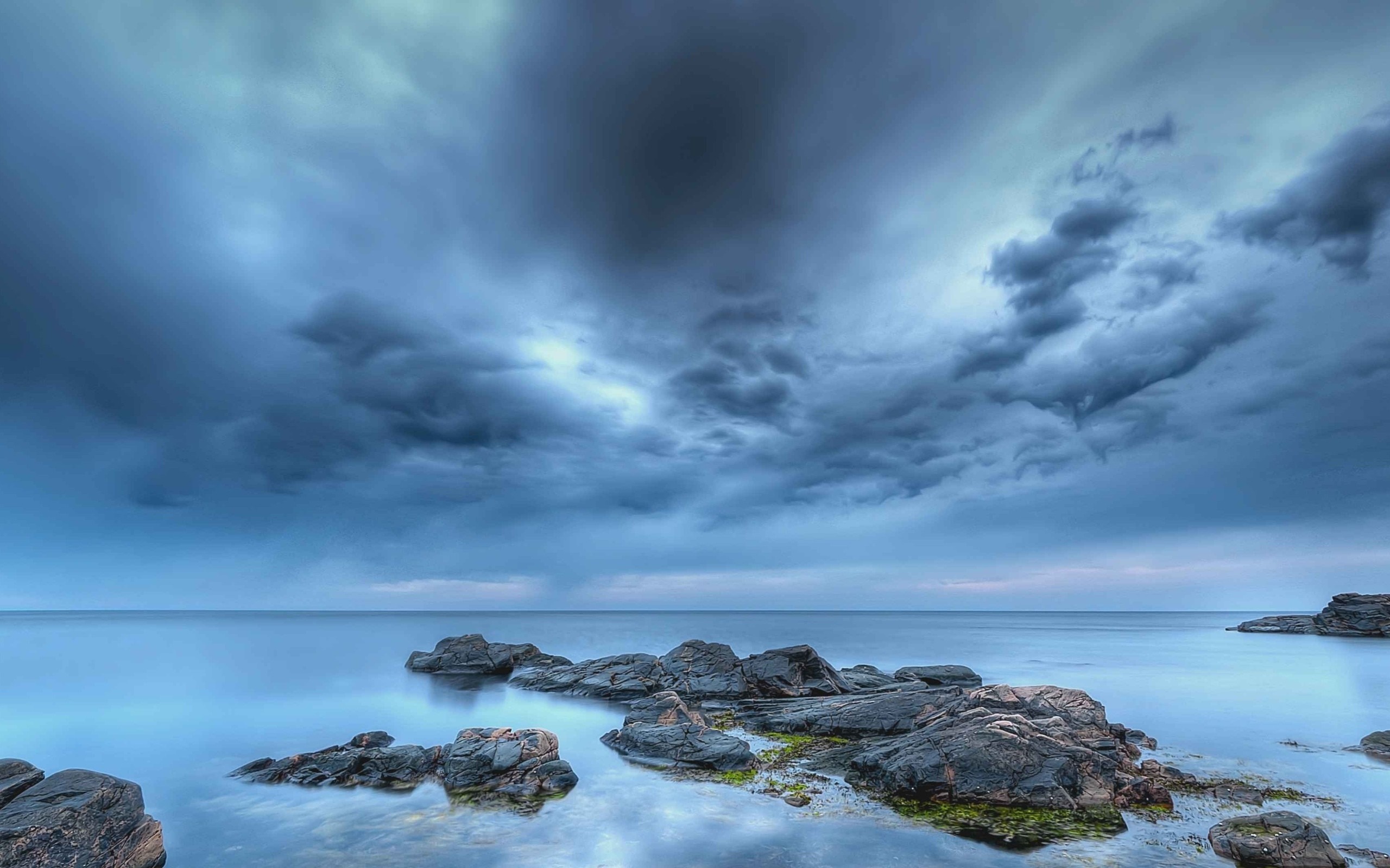 Dark stormy clouds over the sea and rocks HD Wallpaper