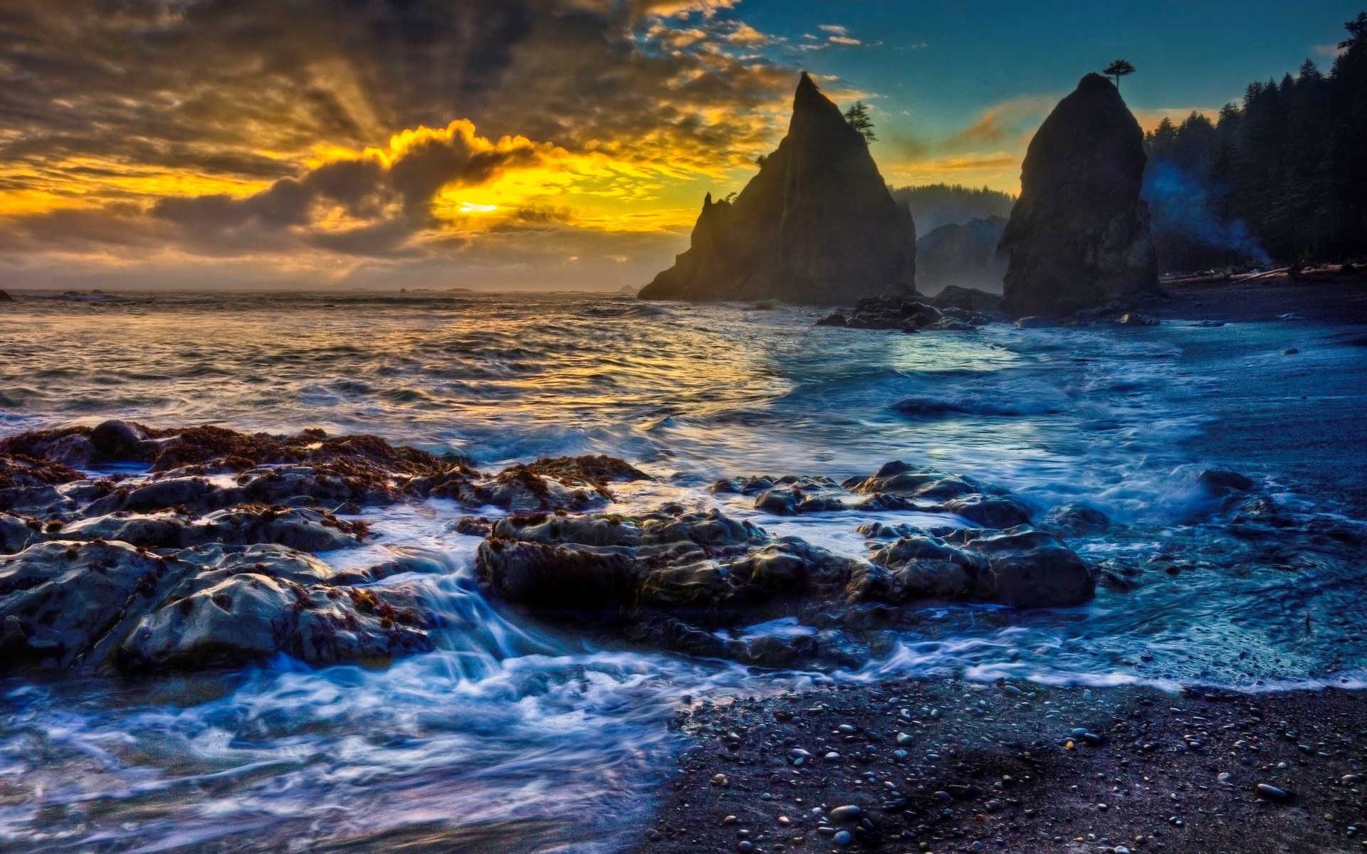 Rocky coastline with dramatic sunset over the ocean HD Wallpaper