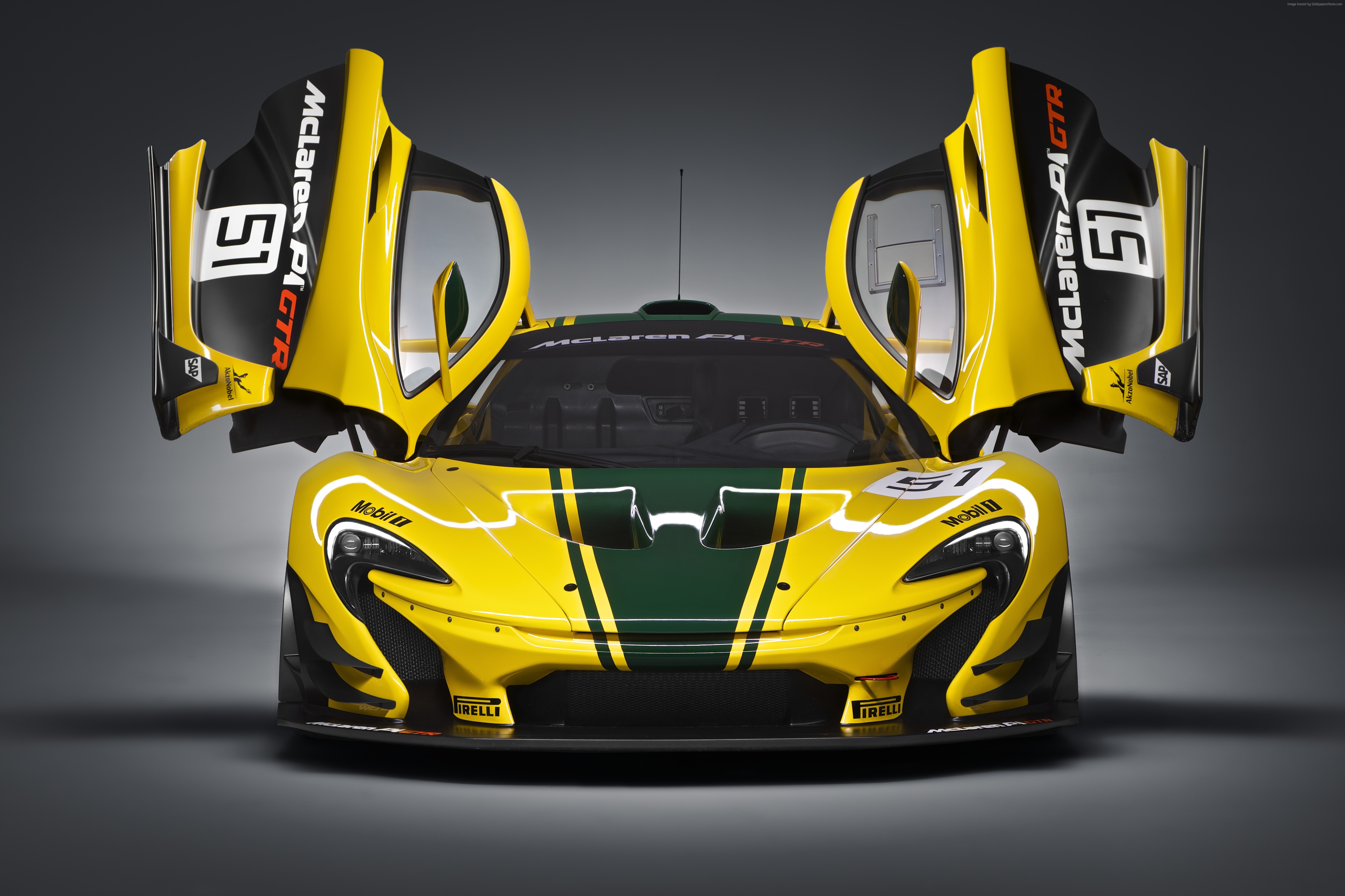 Yellow McLaren P1 GTR race car with doors open HD Wallpaper