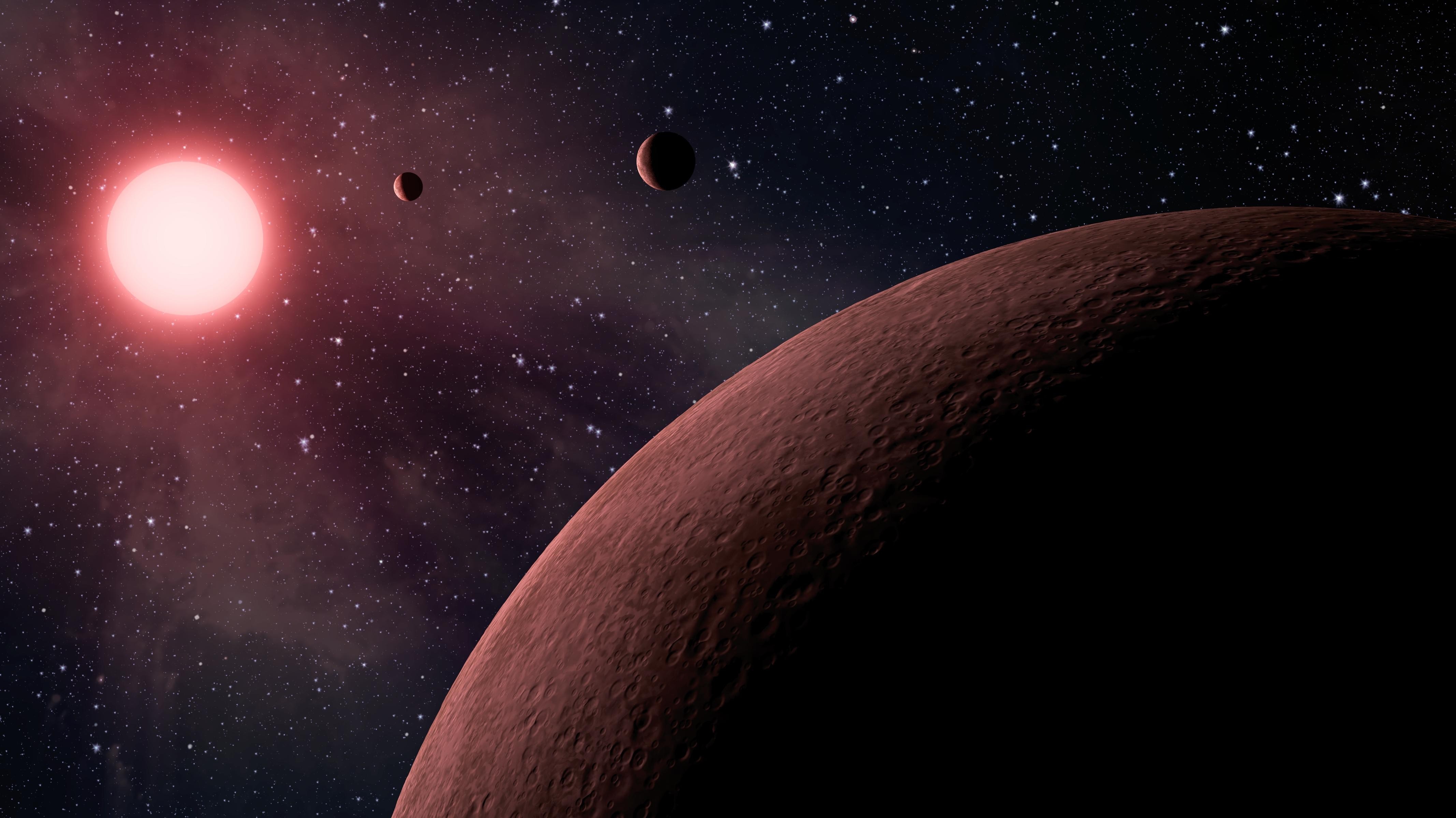Red dwarf star with planets in space HD Wallpaper
