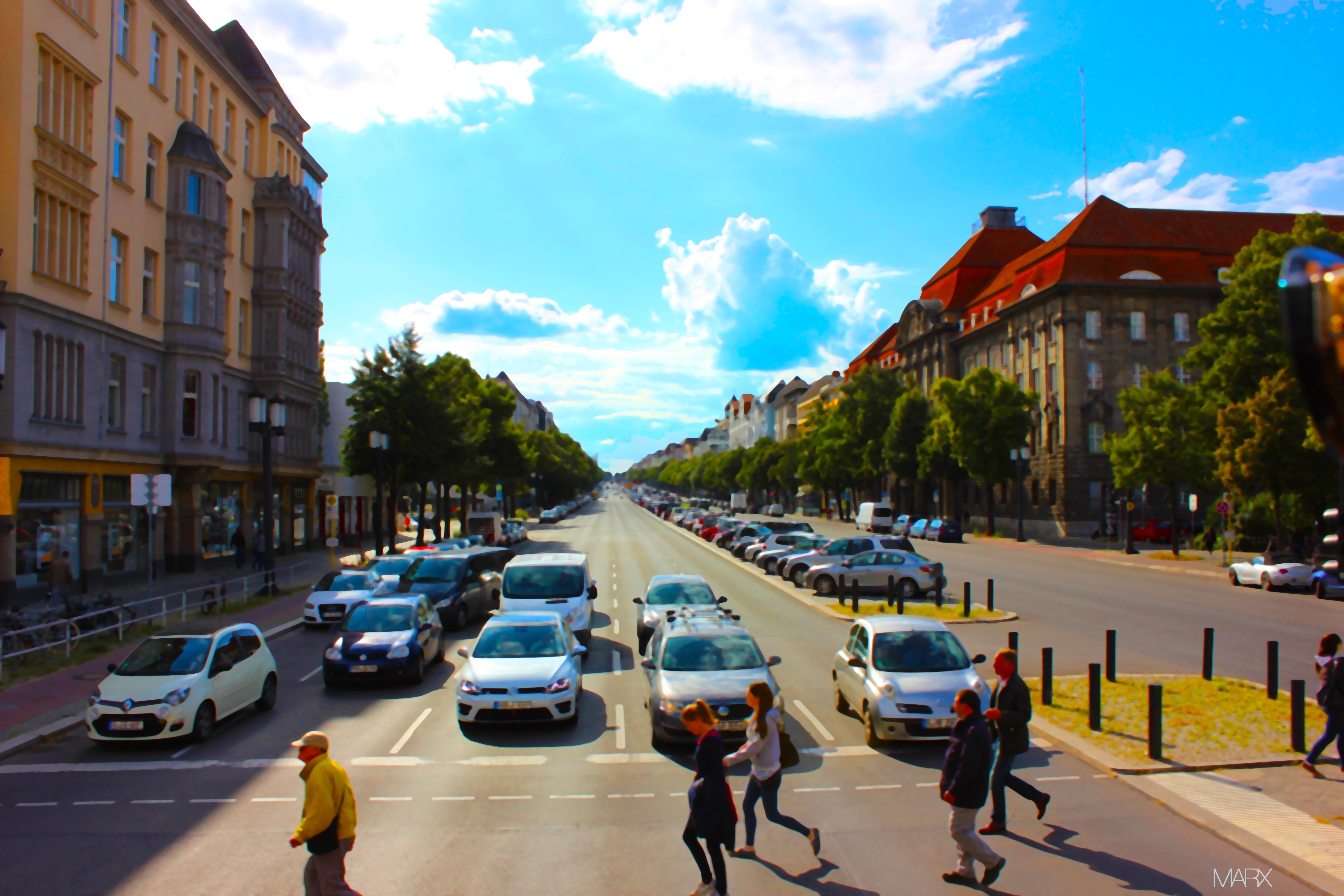 People crossing a busy street in a European city HD Wallpaper