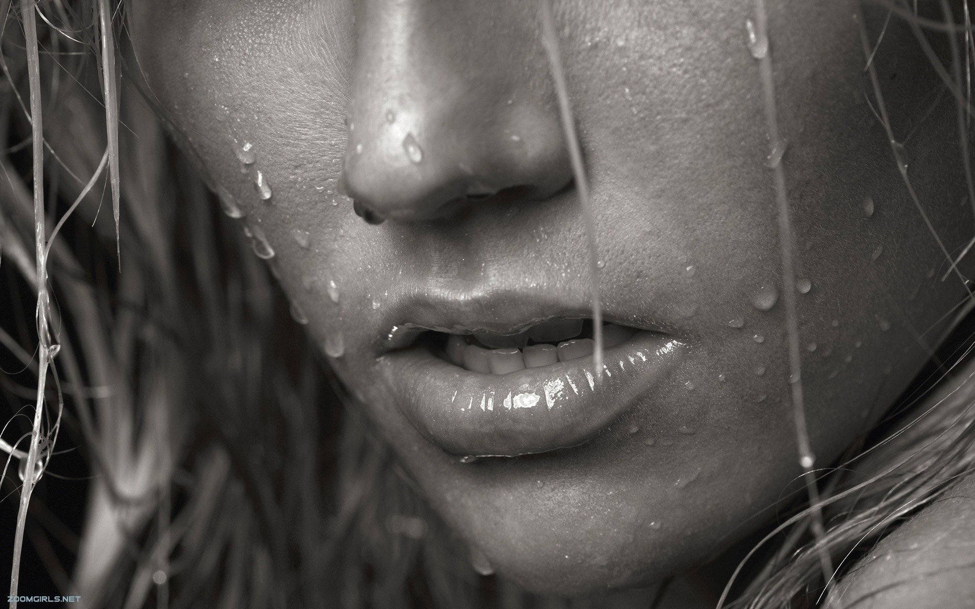 Close up of a woman's face with water droplets HD Wallpaper
