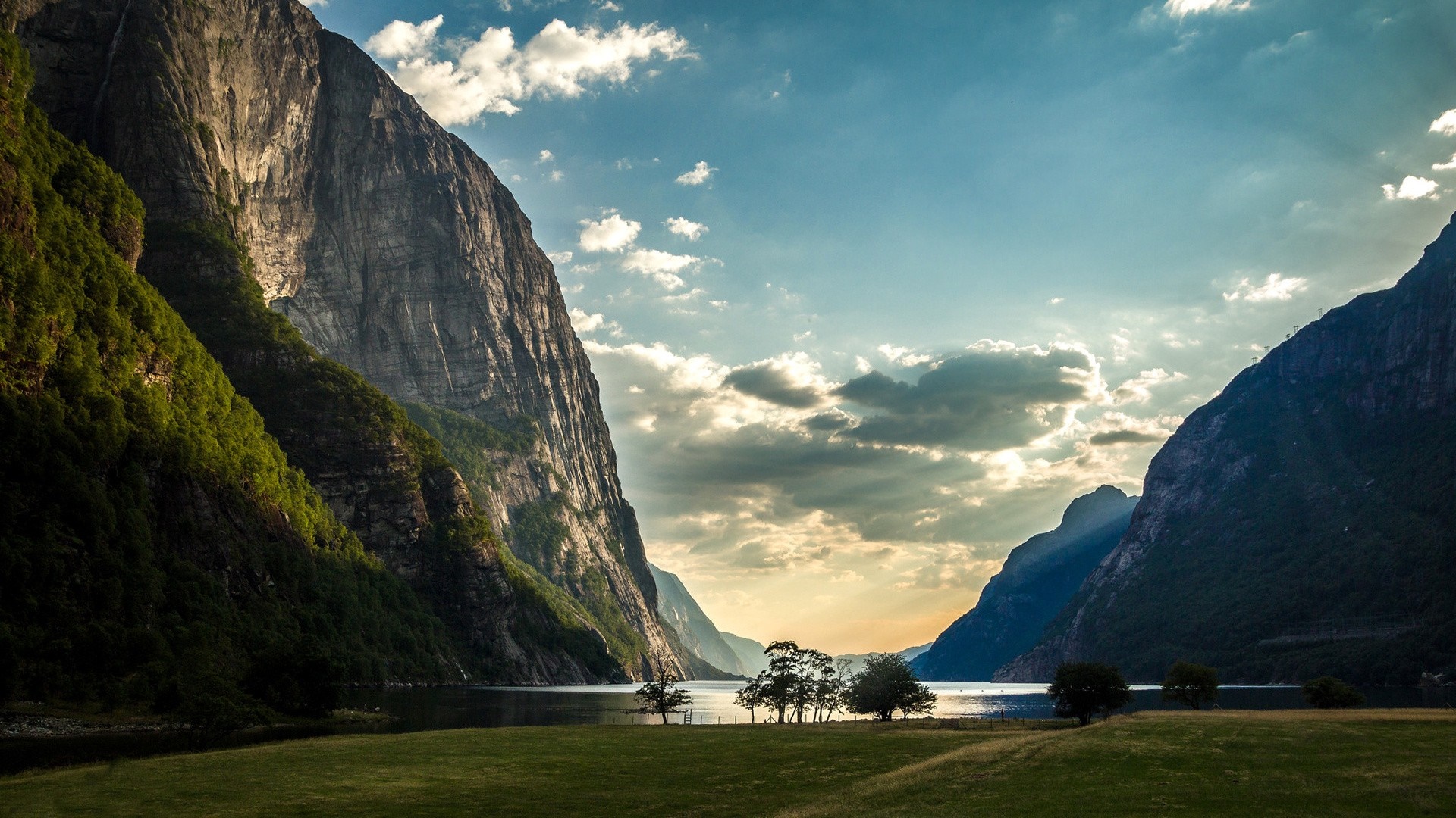 Sunlight on a Fjord with Mountains and Trees HD Wallpaper