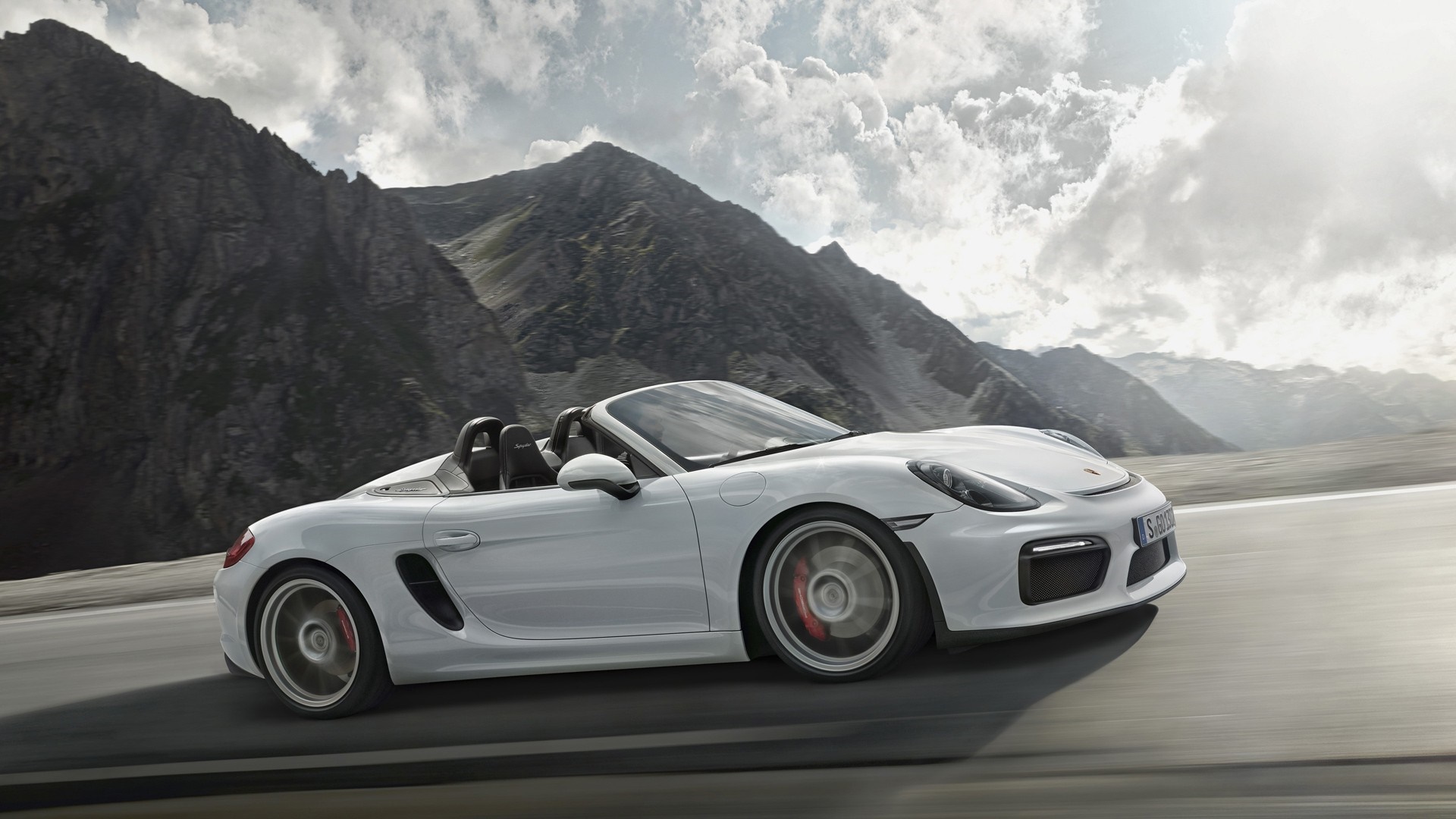 White Porsche Boxster driving on a mountain road HD Wallpaper