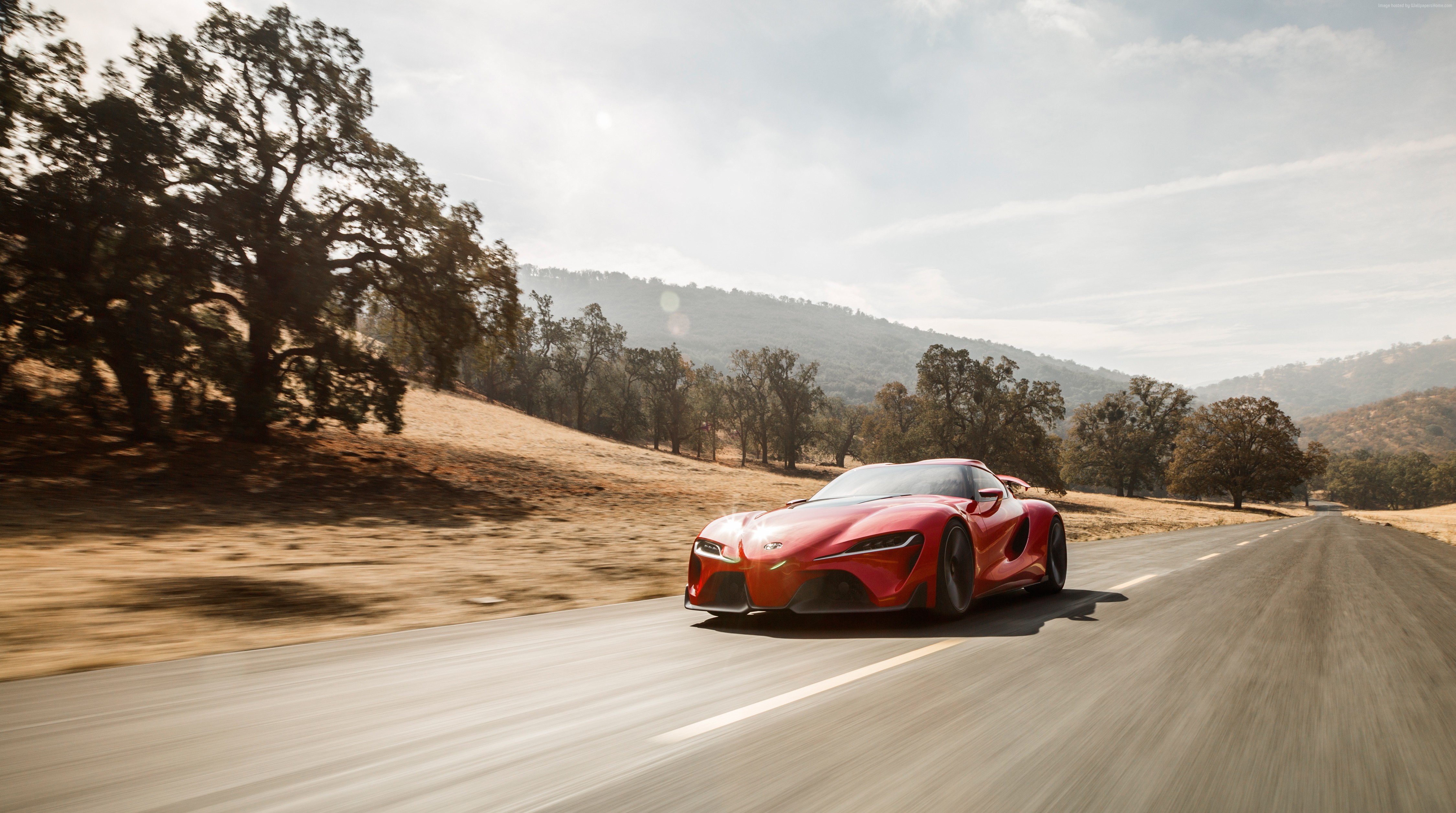 Red Toyota FT1 Concept Car Driving on Road HD Wallpaper