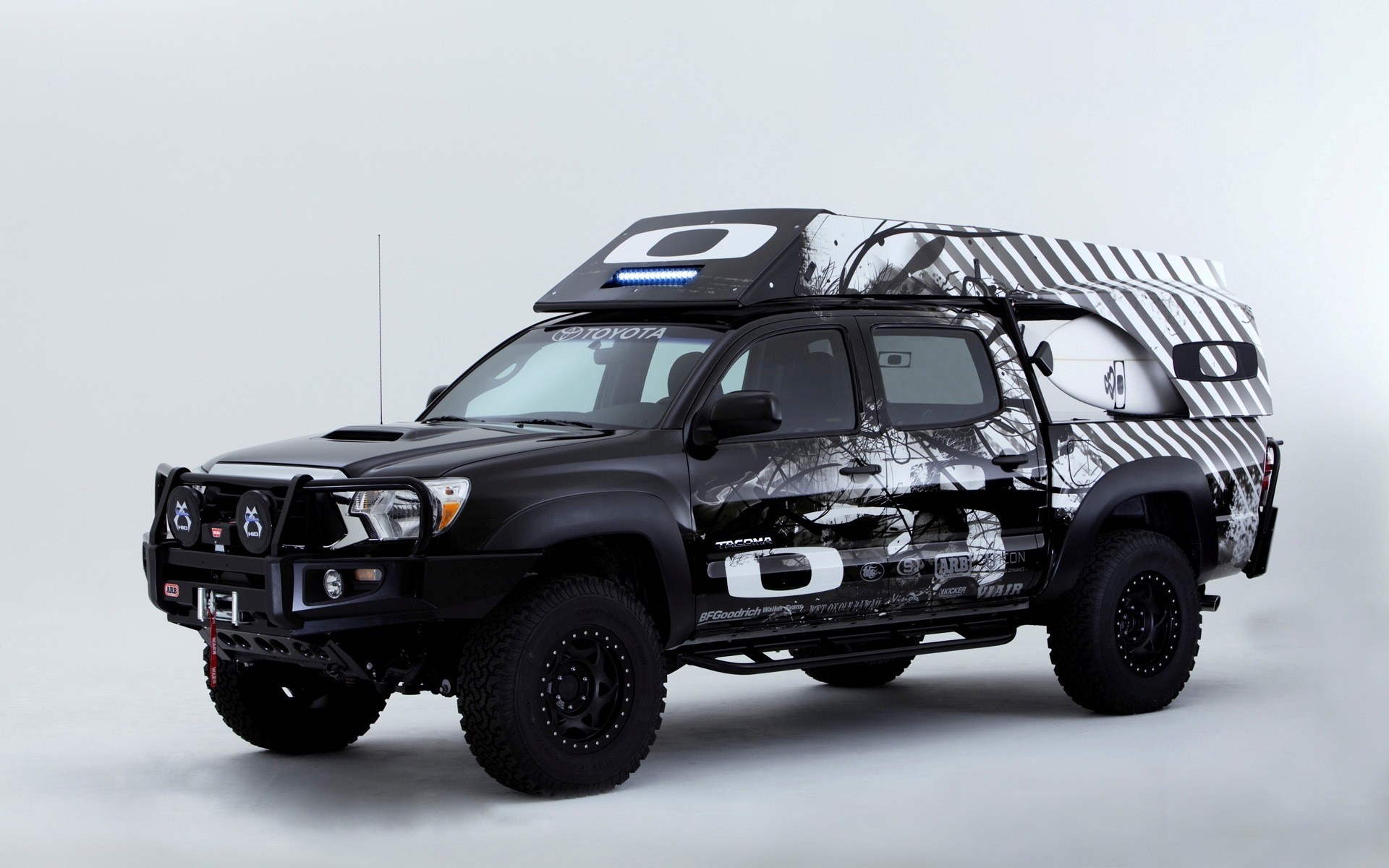 Oakley Surf Toyota Tacoma pickup truck with surfboard HD Wallpaper