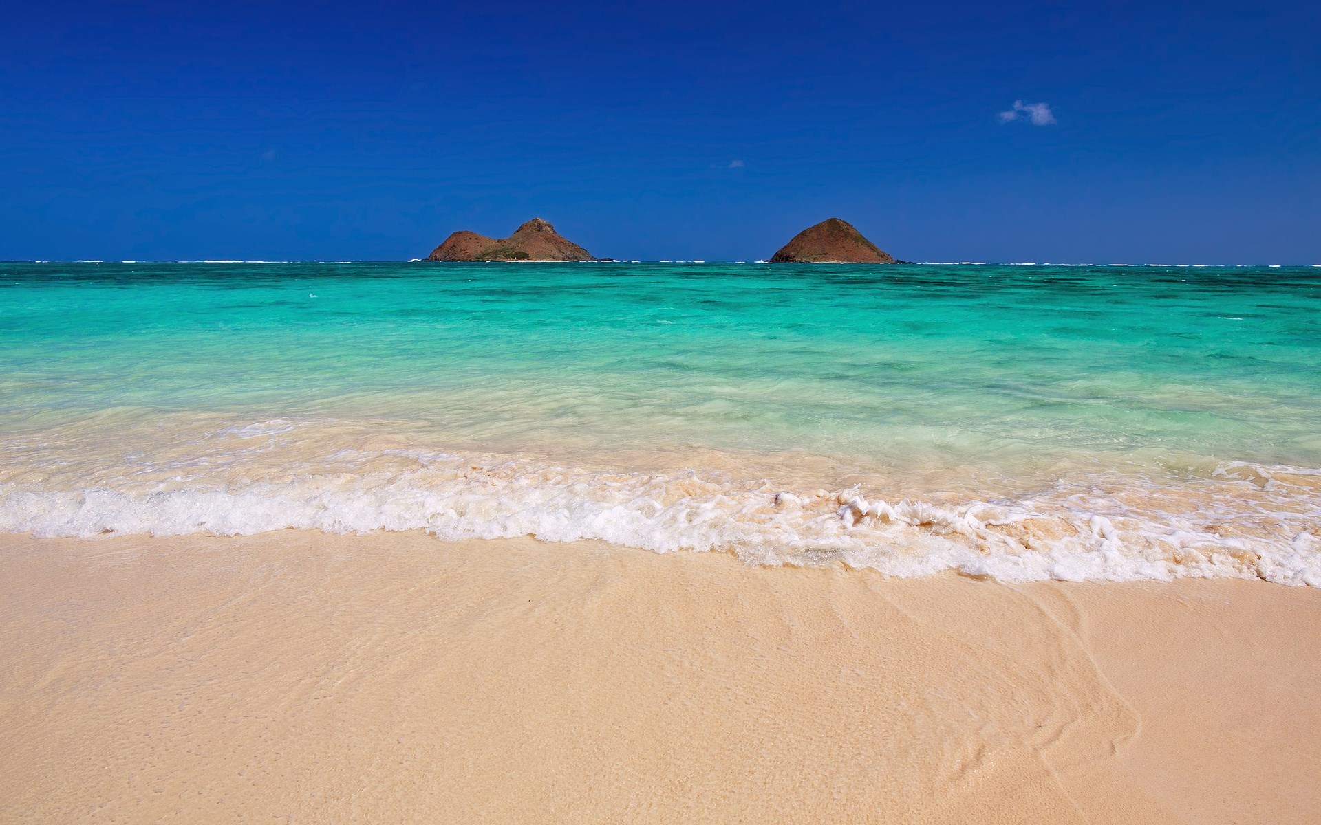 Two islands in the ocean with a beach and waves HD Wallpaper