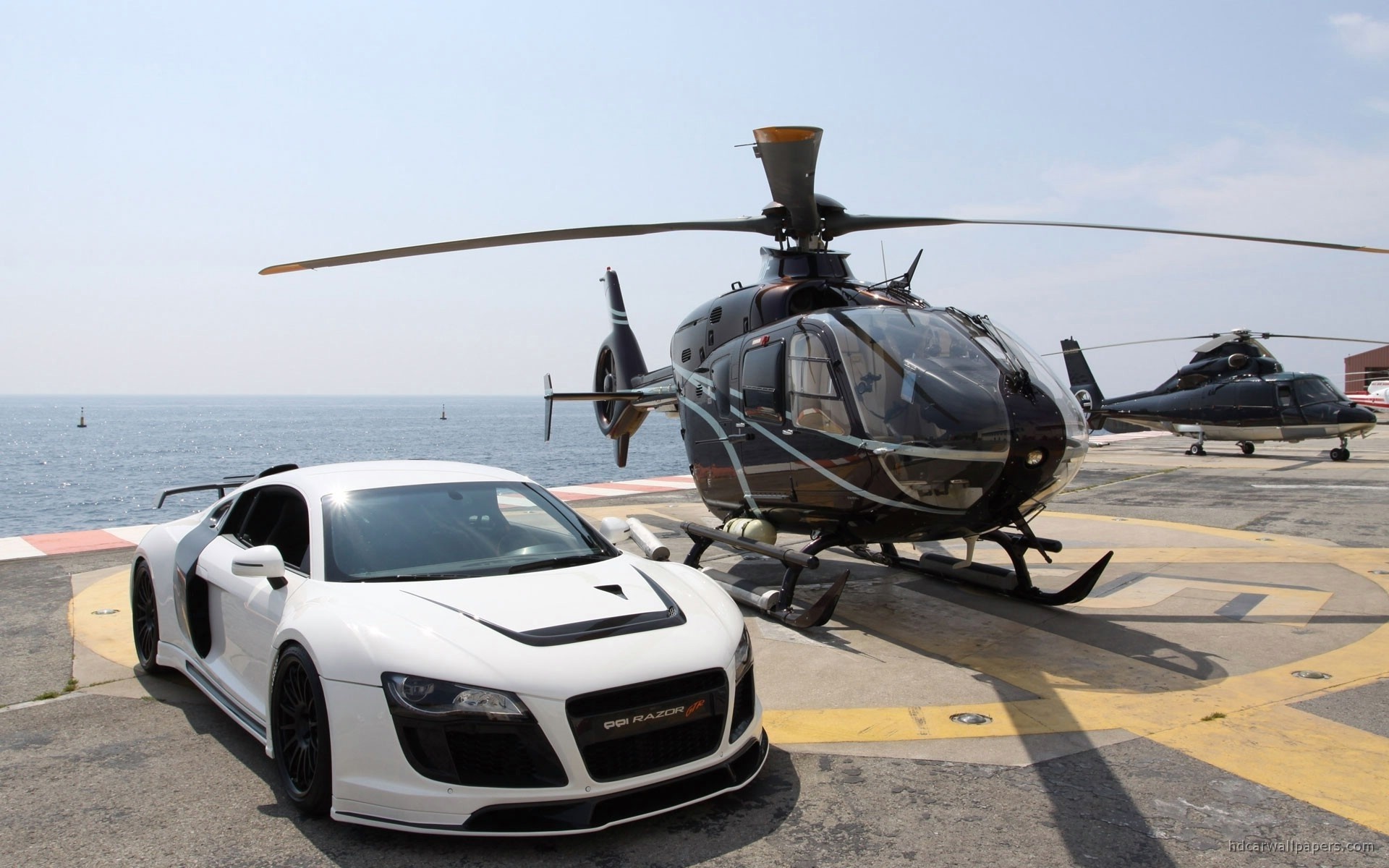 White sports car and helicopters on helipad HD Wallpaper