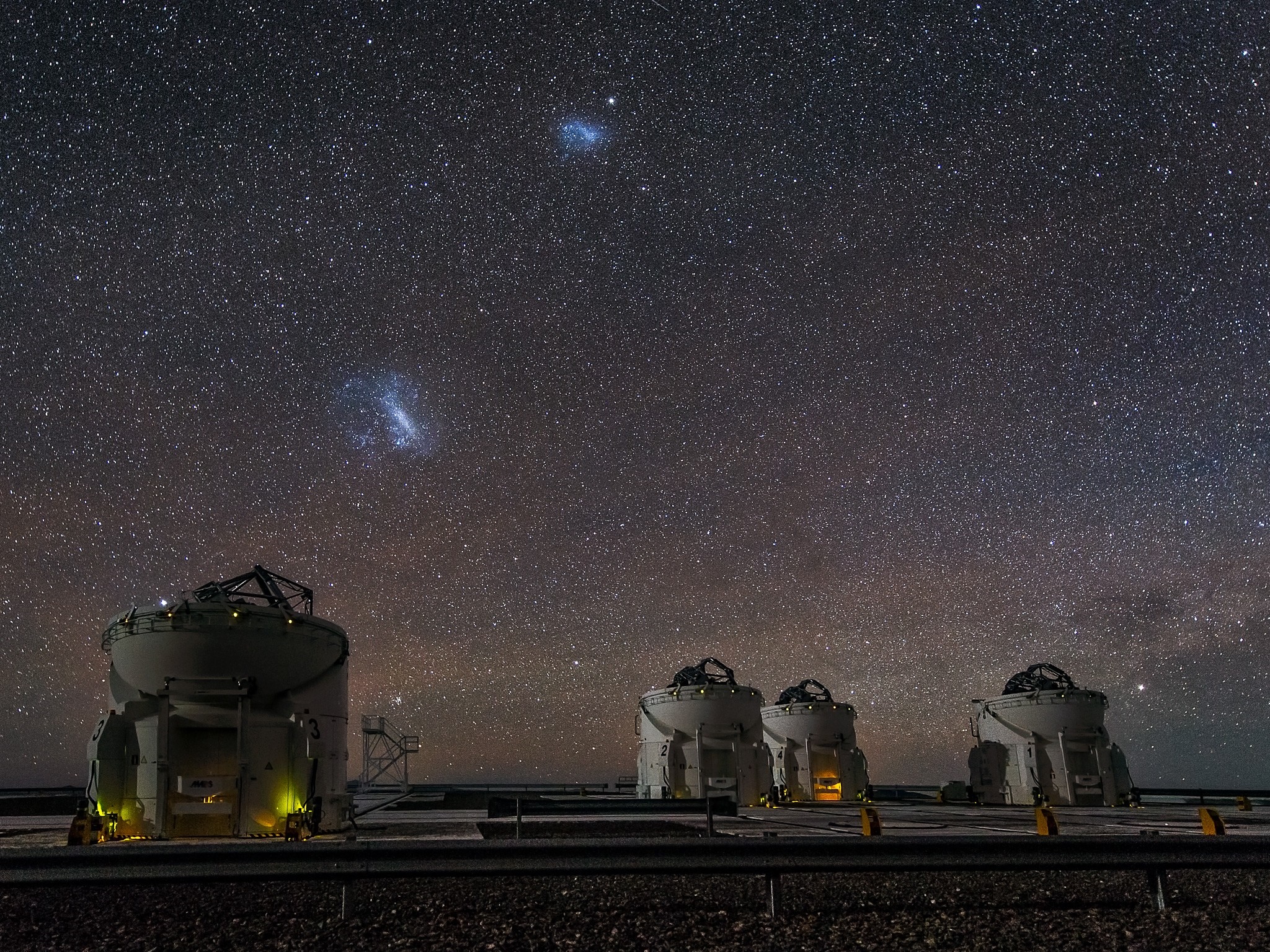 Observatory domes under a starry night sky in Atacama Desert, Chile HD Wallpaper