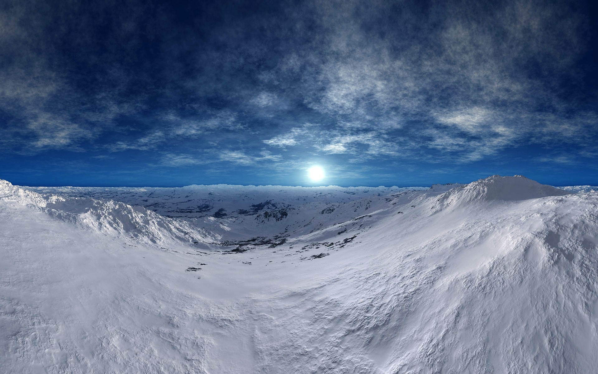 Snowy mountain landscape under a cloudy blue sky with a bright sun HD Wallpaper