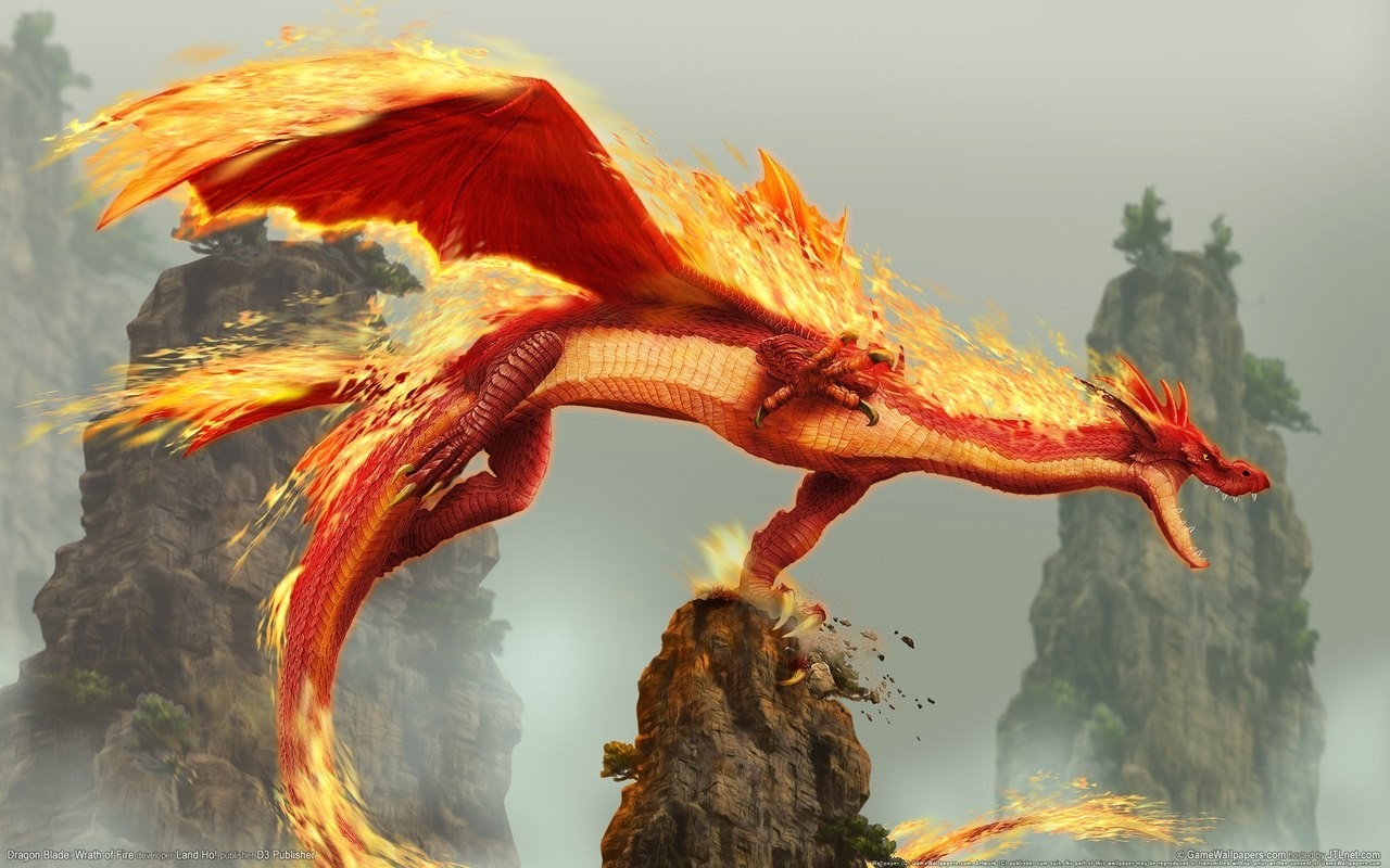 A fiery red dragon perched on a rocky outcrop HD Wallpaper