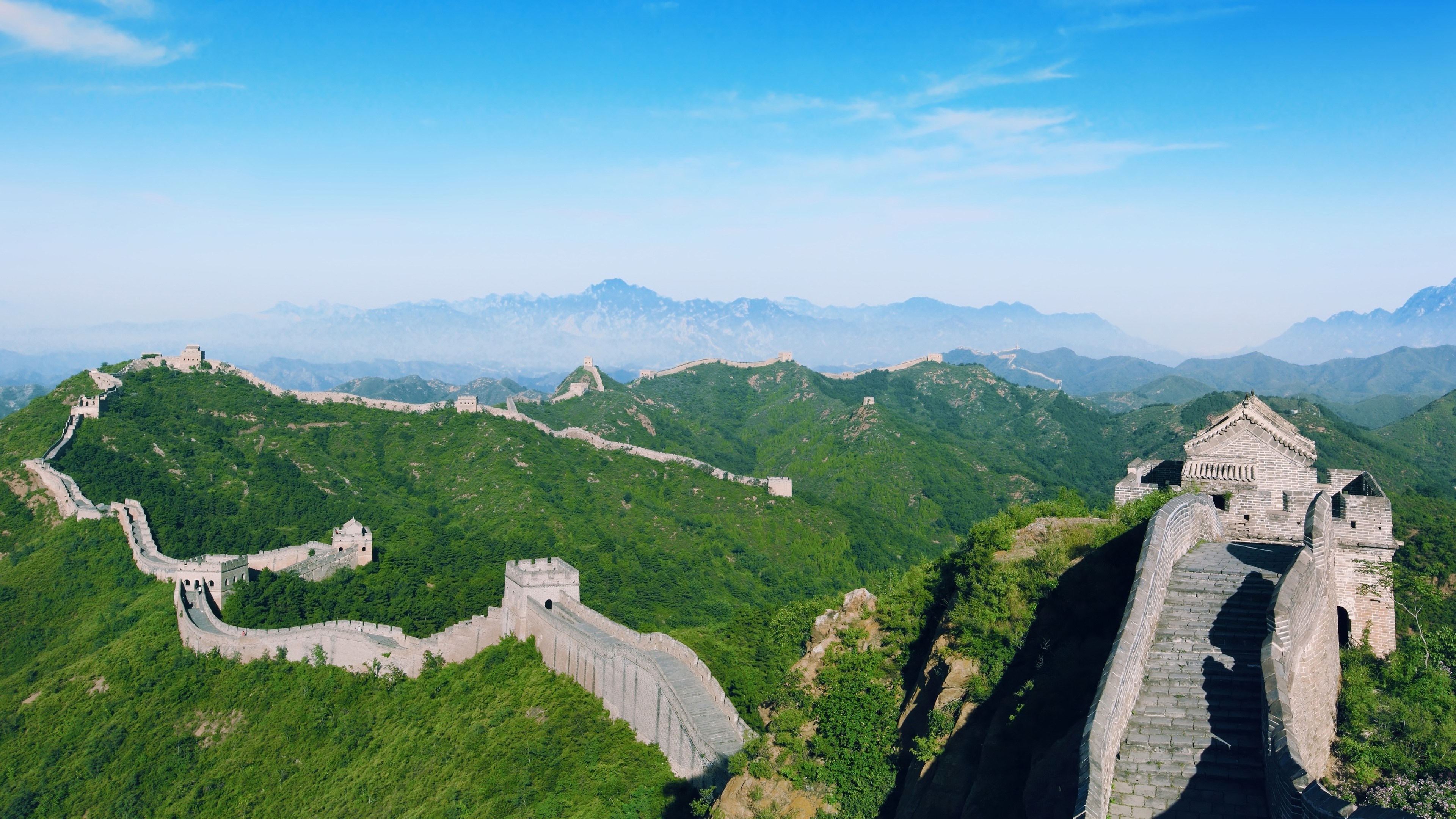 The Great Wall of China winding through green mountains HD Wallpaper