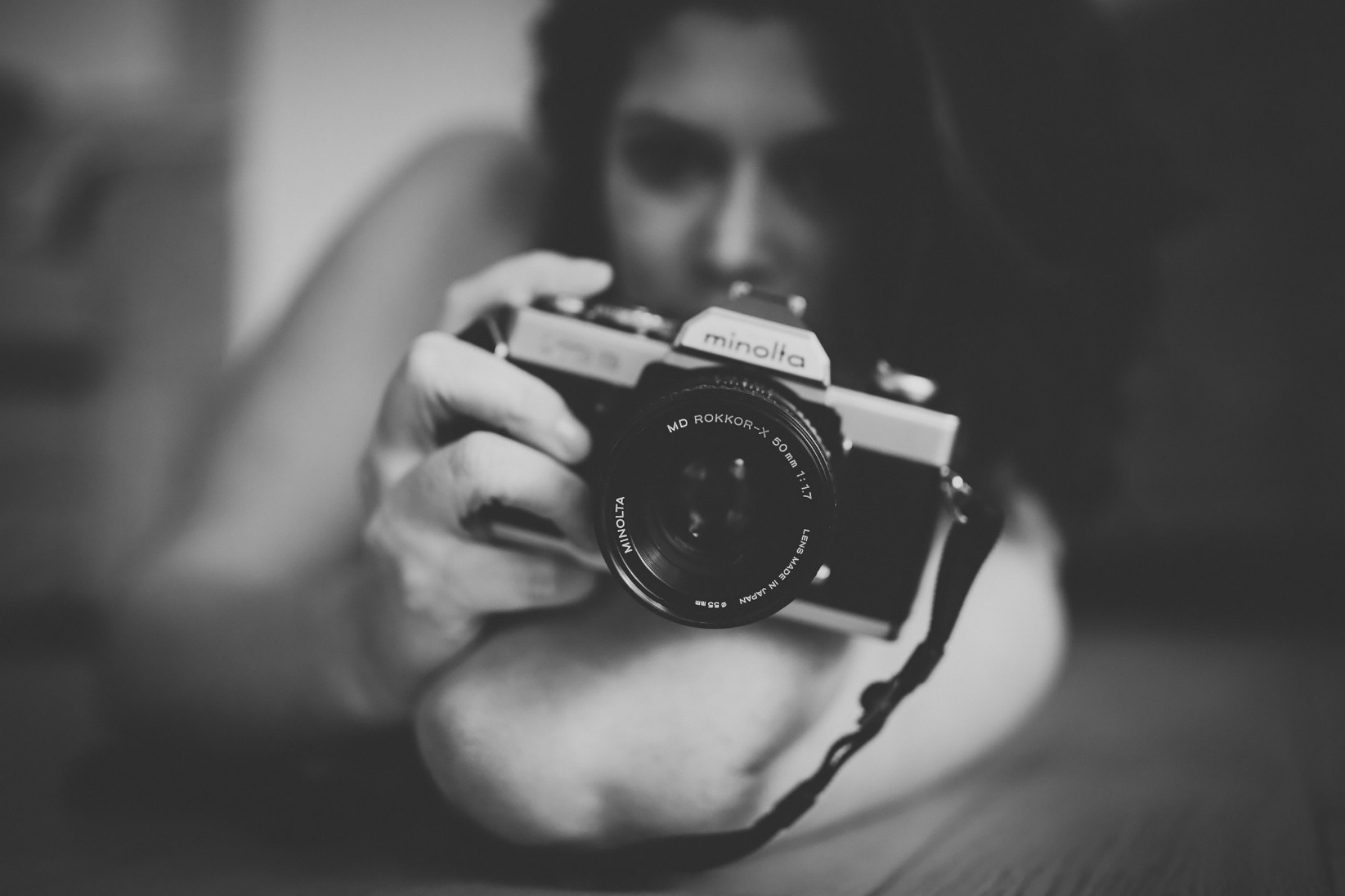 Woman holding a Minolta camera HD Wallpaper