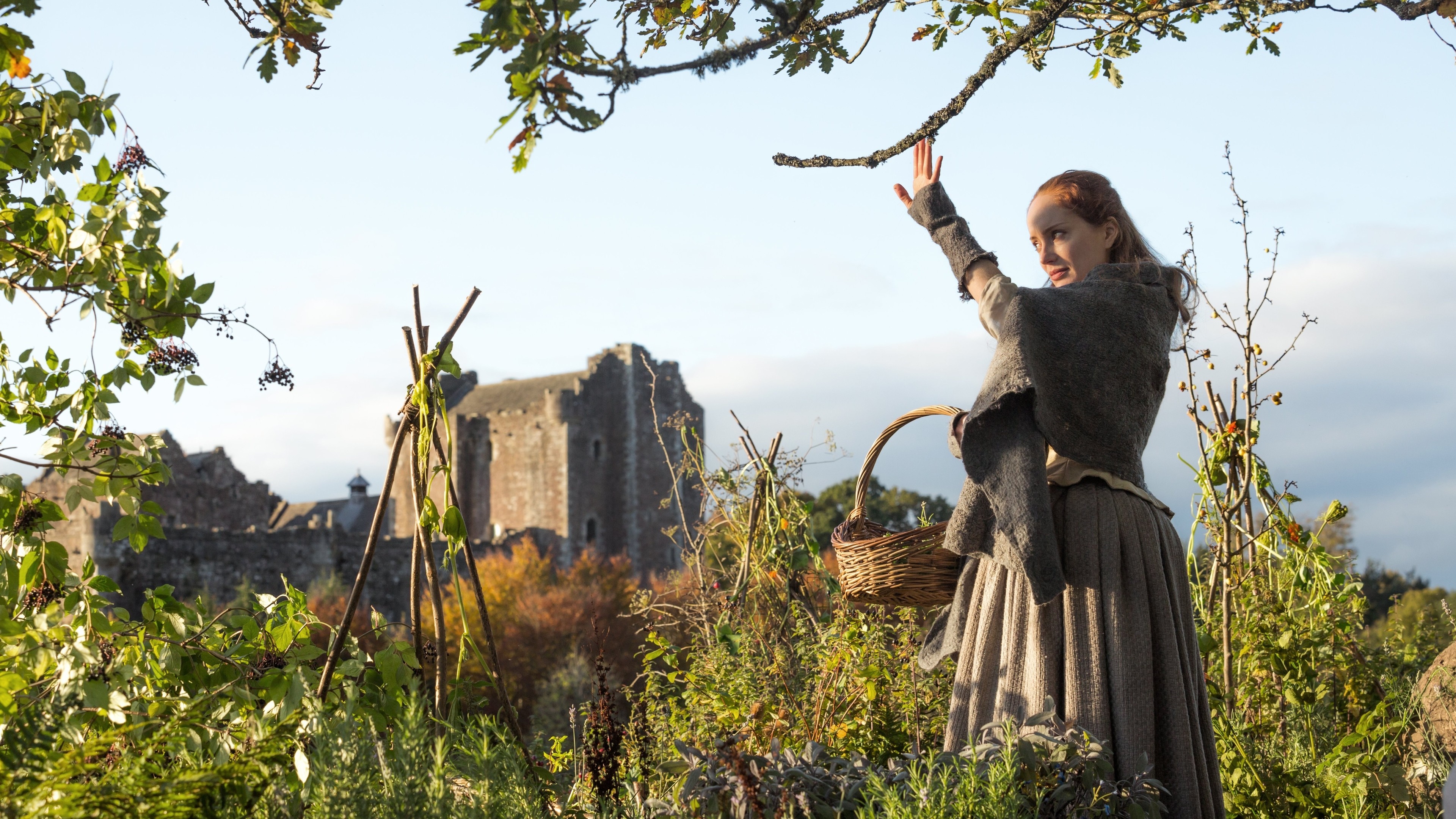 Woman with basket in front of castle HD Wallpaper
