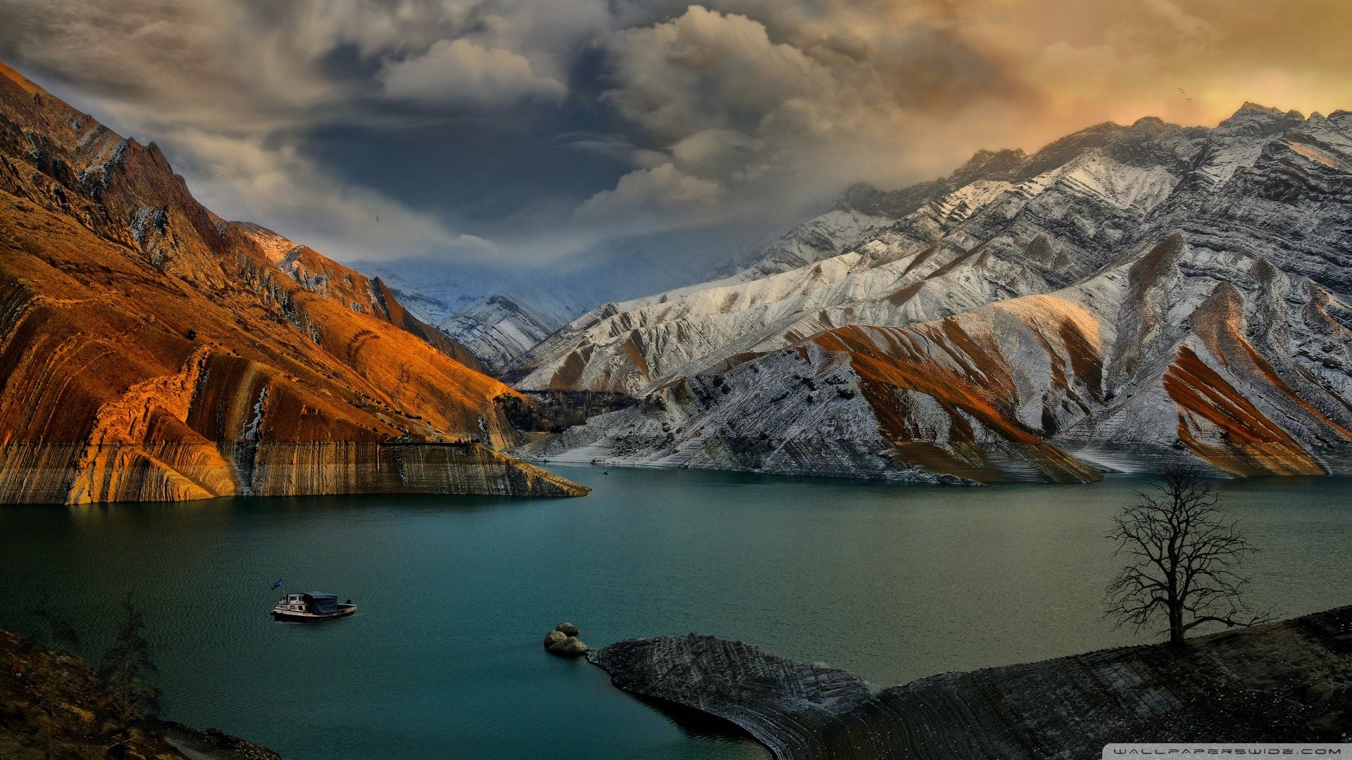 Mountains and lake with a boat at sunset HD Wallpaper