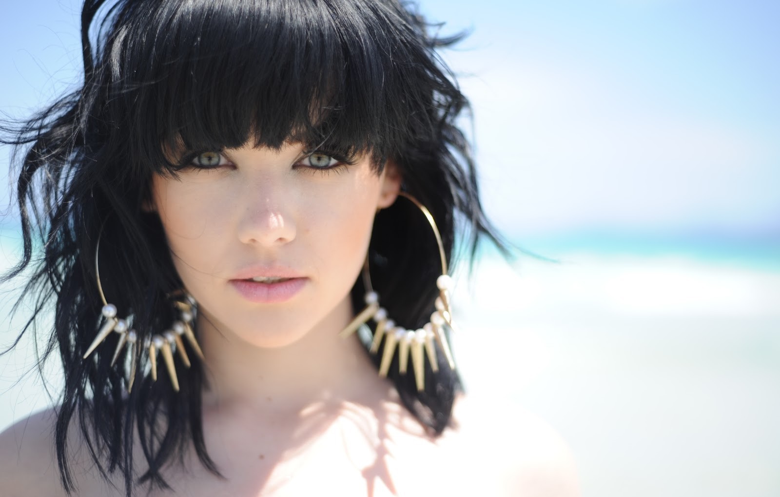 Woman with black hair and large hoop earrings HD Wallpaper