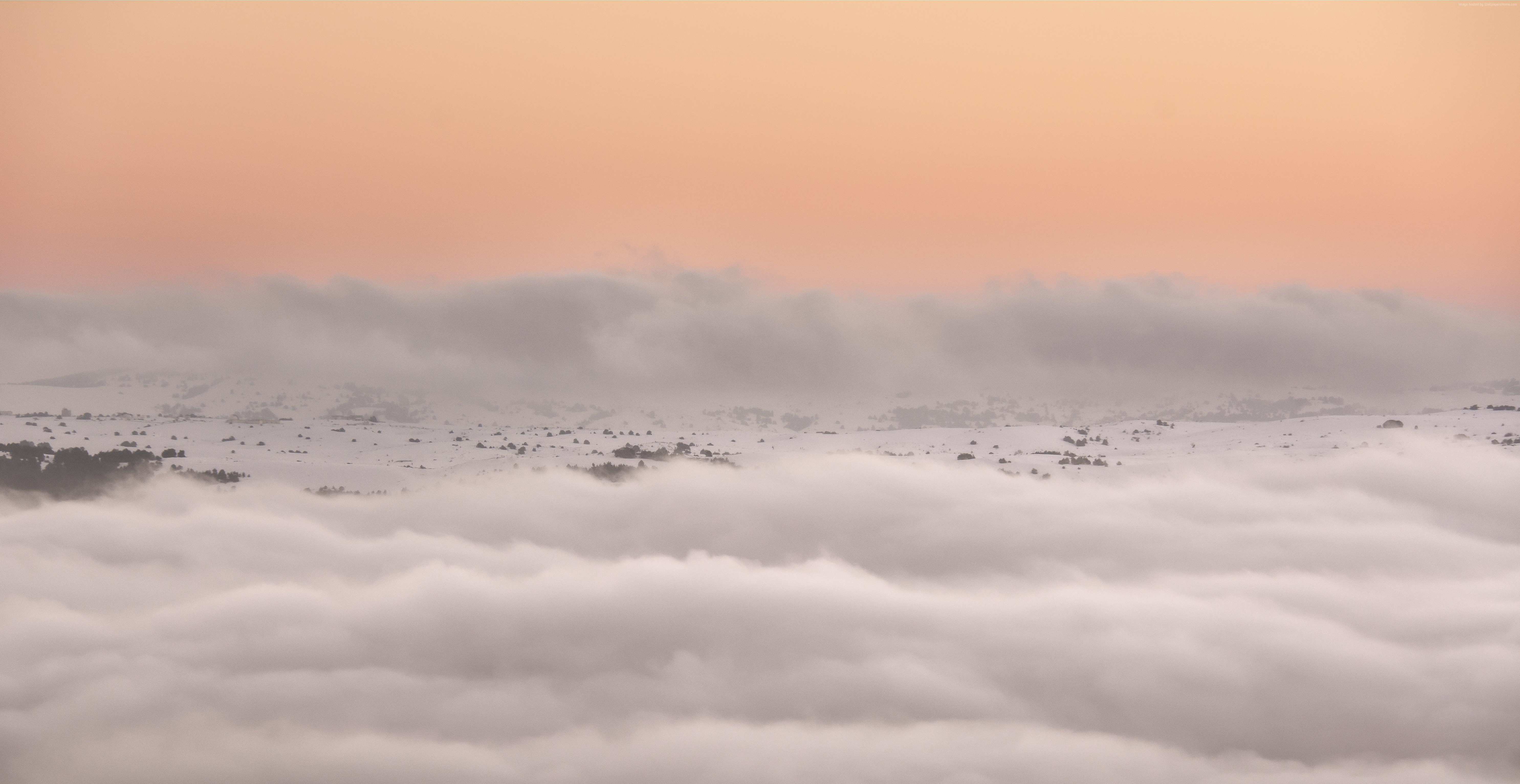 Clouds over mountains at sunset HD Wallpaper