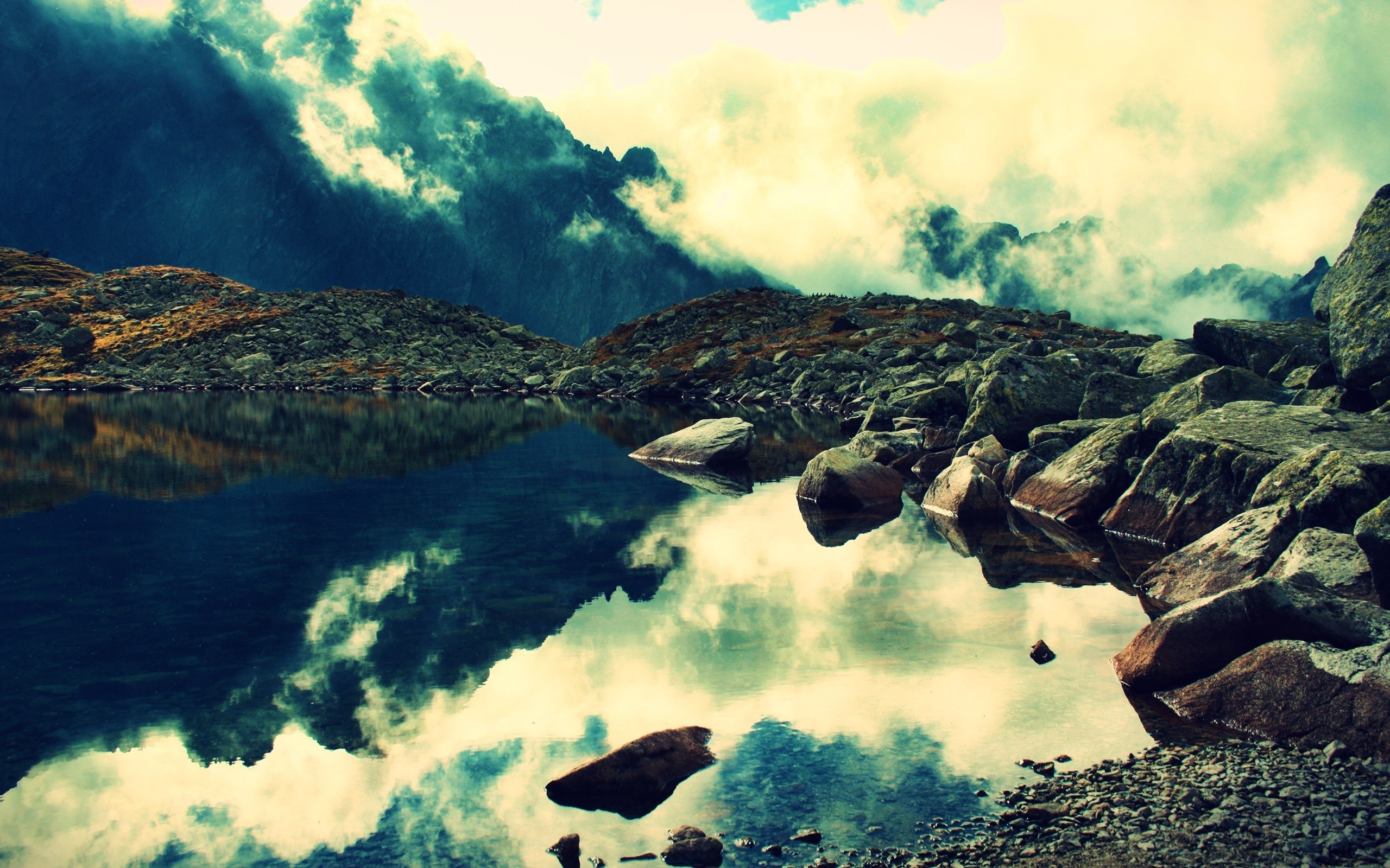 Rocky mountain lake with cloudy sky reflection HD Wallpaper