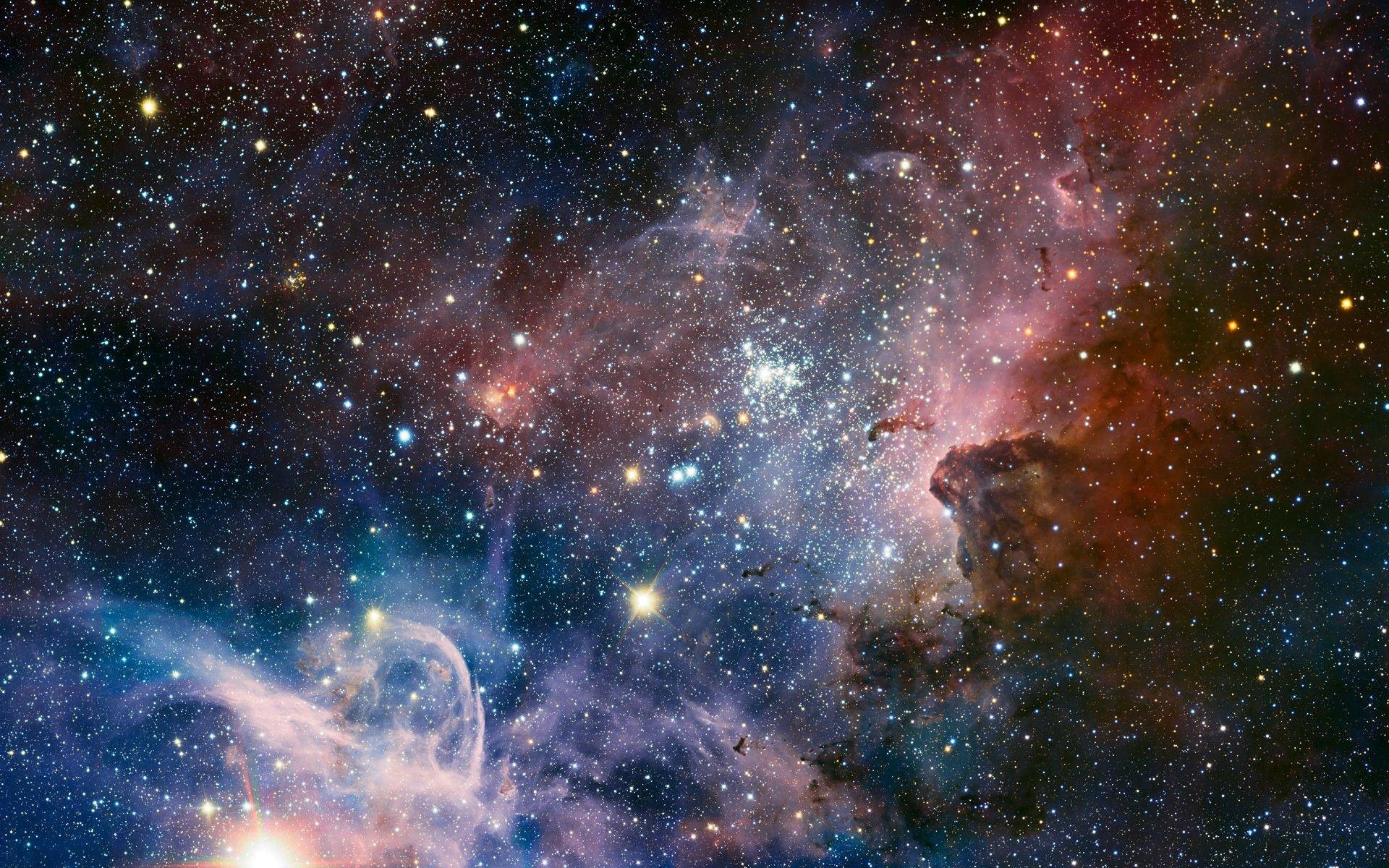 Vast starfield with colorful nebulae and star clusters HD Wallpaper