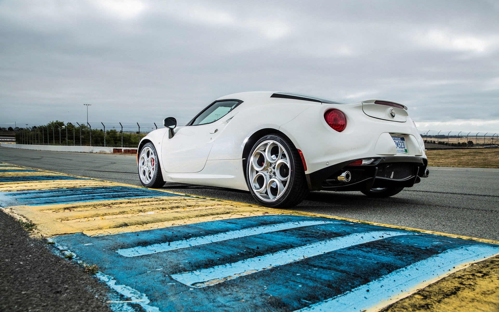 White Alfa Romeo 4C on a Racetrack HD Wallpaper