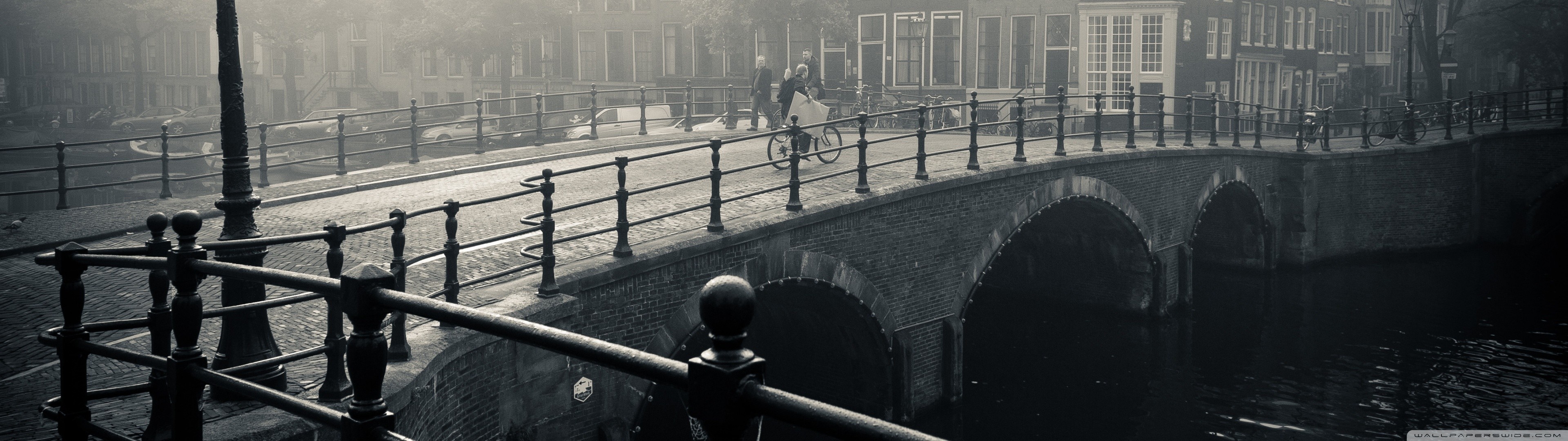 Monochrome bridge with people and bicycle in Amsterdam HD Wallpaper