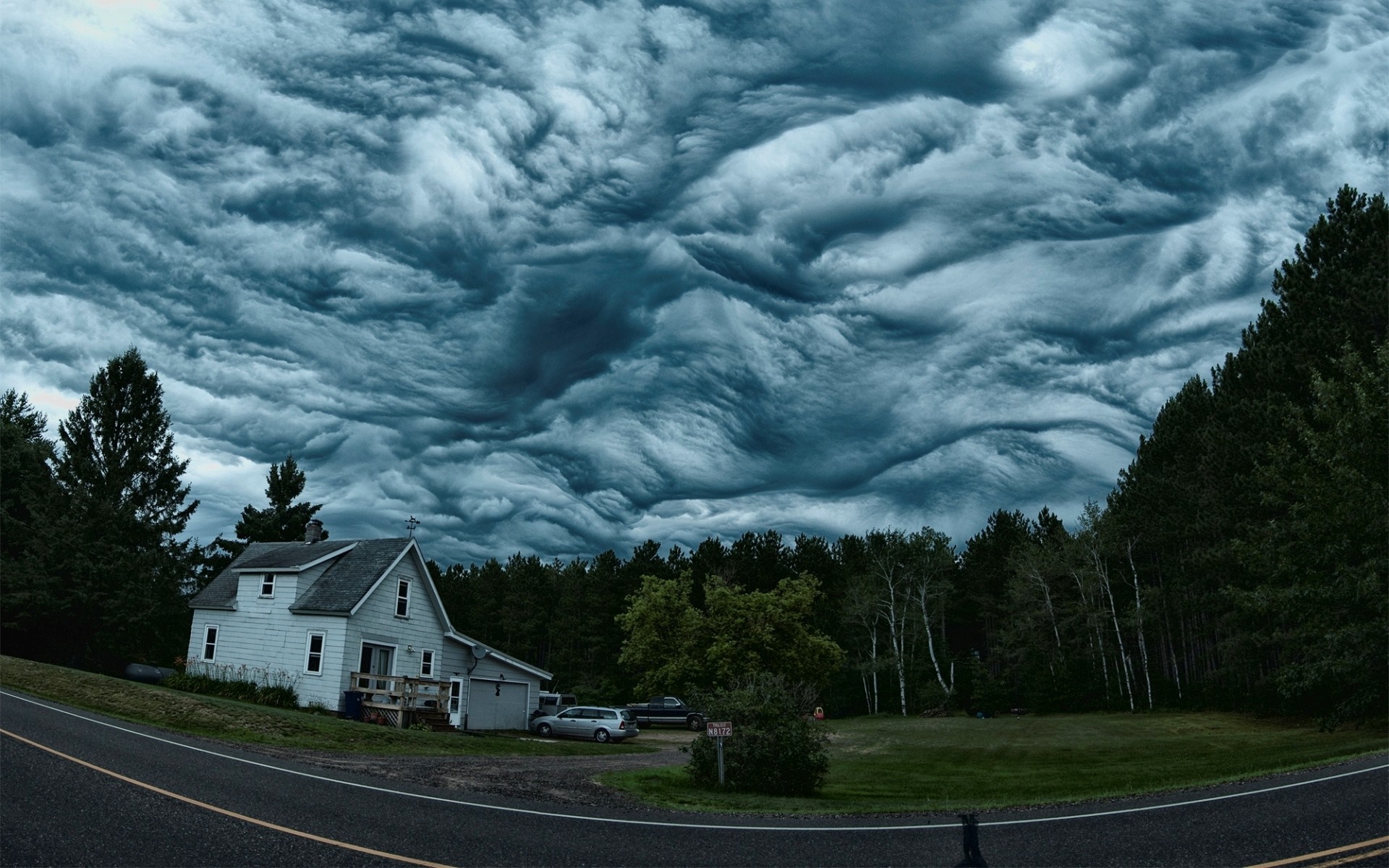 Stormy sky over a house and forest HD Wallpaper