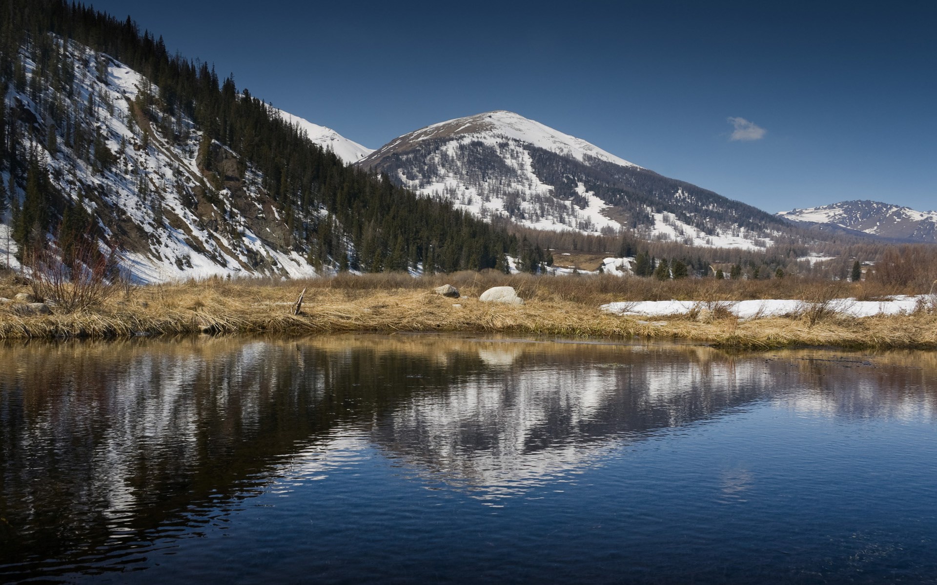 Snow-capped mountains reflected in a calm river HD Wallpaper