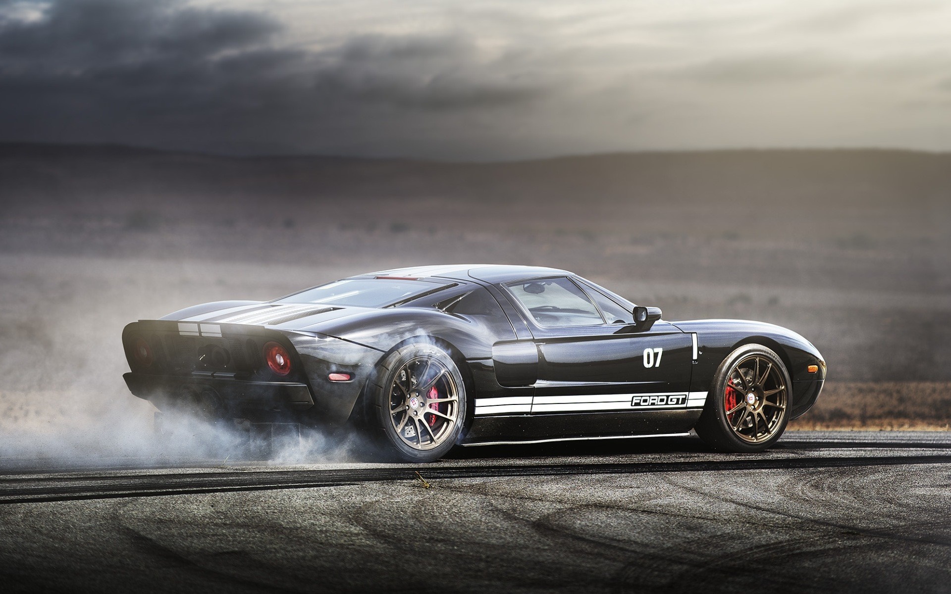 Black Ford GT sports car drifting with smoke HD Wallpaper