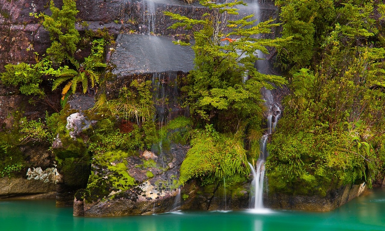 Serene Waterfall and Turquoise Lake in Patagonia HD Wallpaper