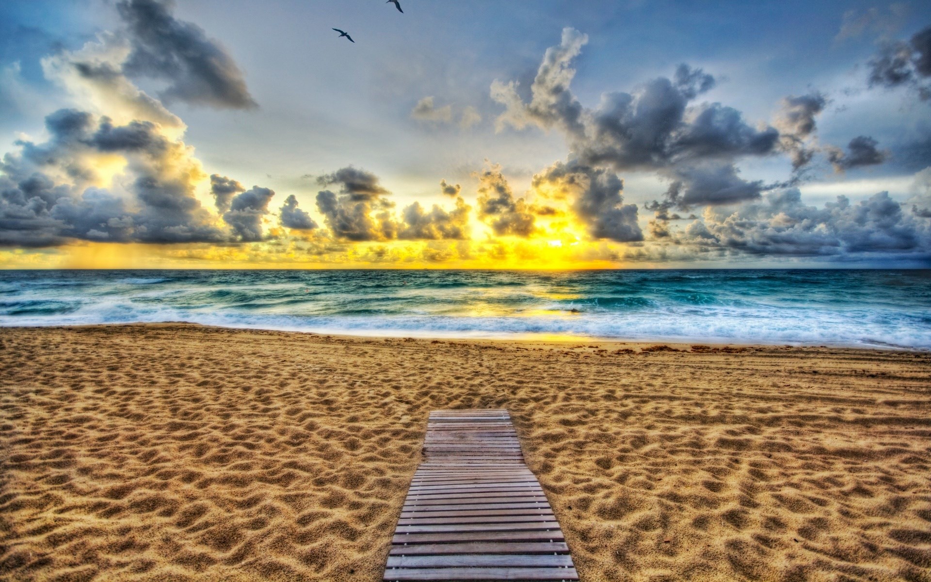 Wooden boardwalk on a sandy beach at sunset HD Wallpaper