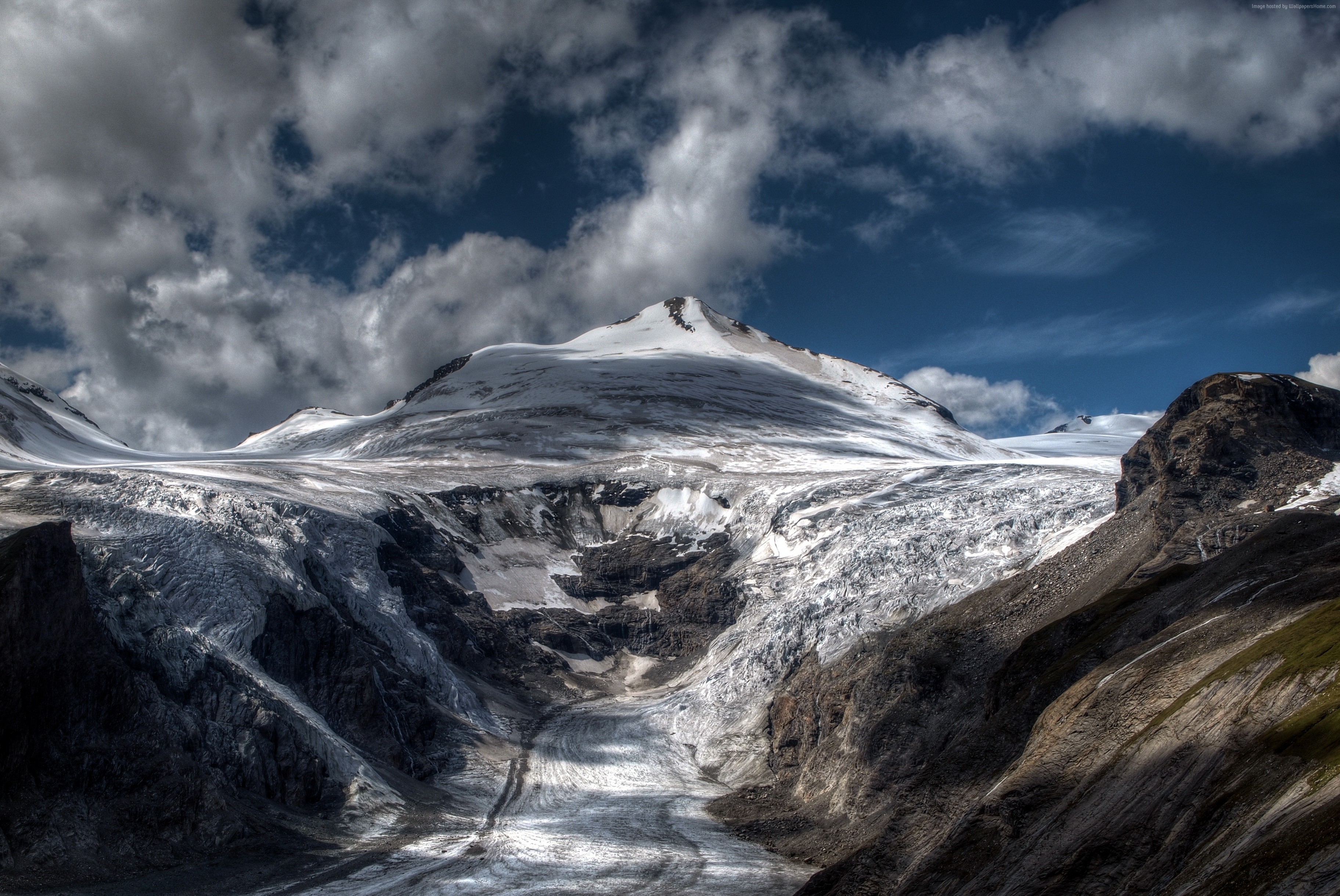 Snow-capped Alps mountain range with glacier under cloudy sky HD Wallpaper