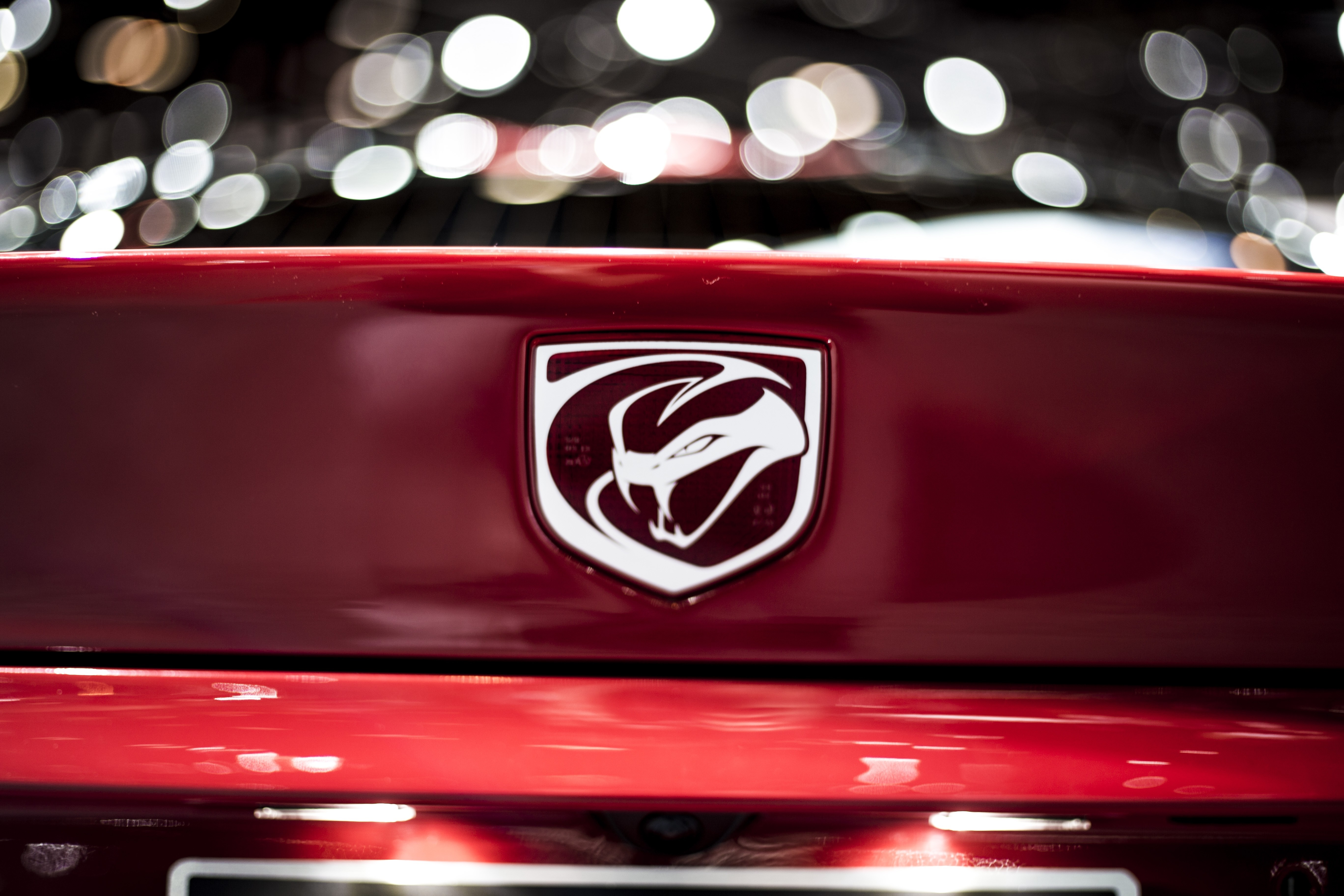 Dodge Viper emblem on a red car HD Wallpaper
