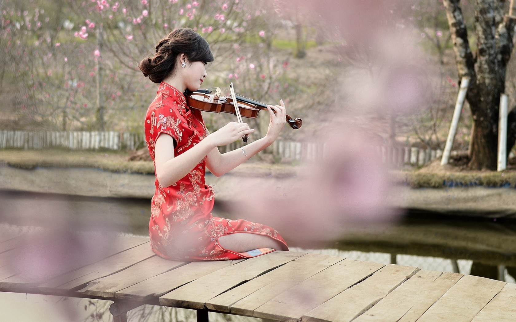 Woman in Red Dress Playing Violin on Wooden Pier HD Wallpaper
