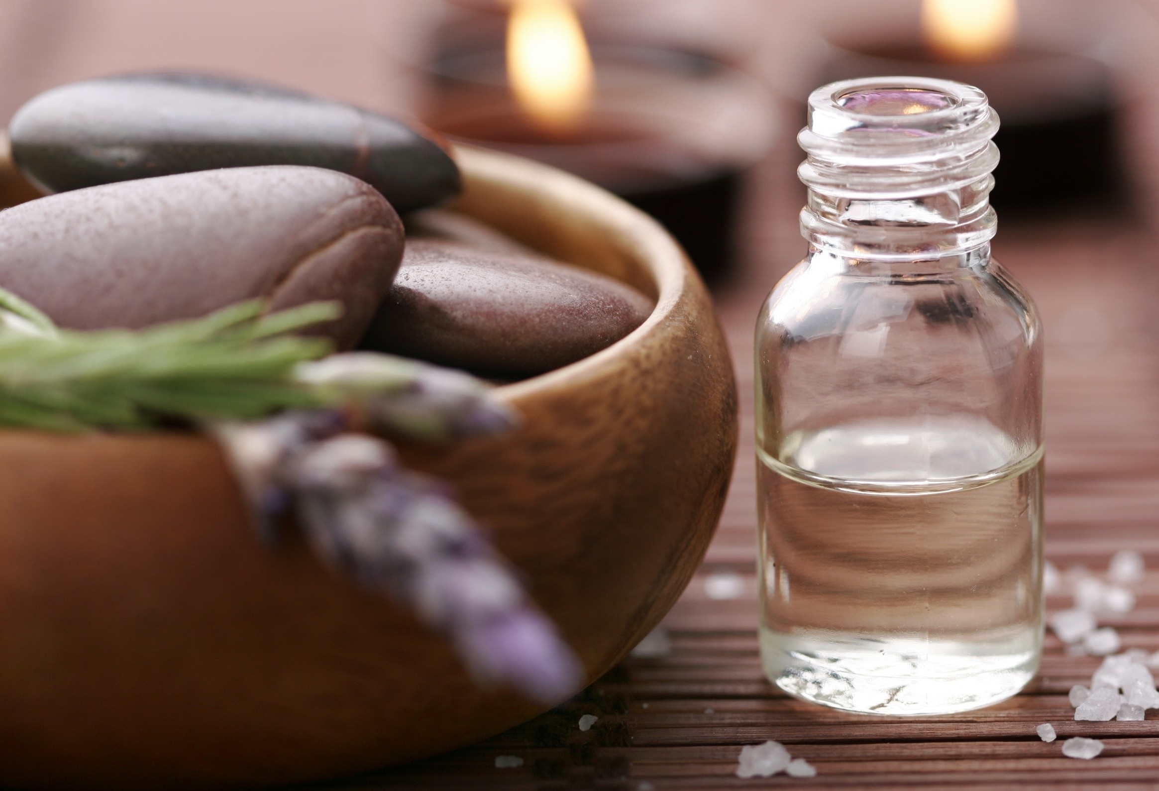 Spa stones, lavender, and essential oil bottle HD Wallpaper