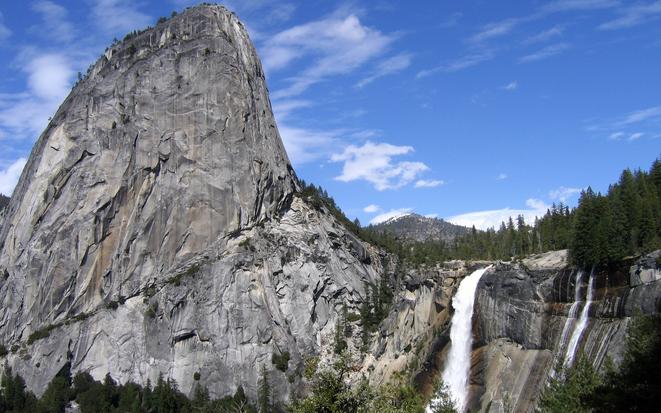 Granite cliff and waterfall in a mountainous landscape HD Wallpaper