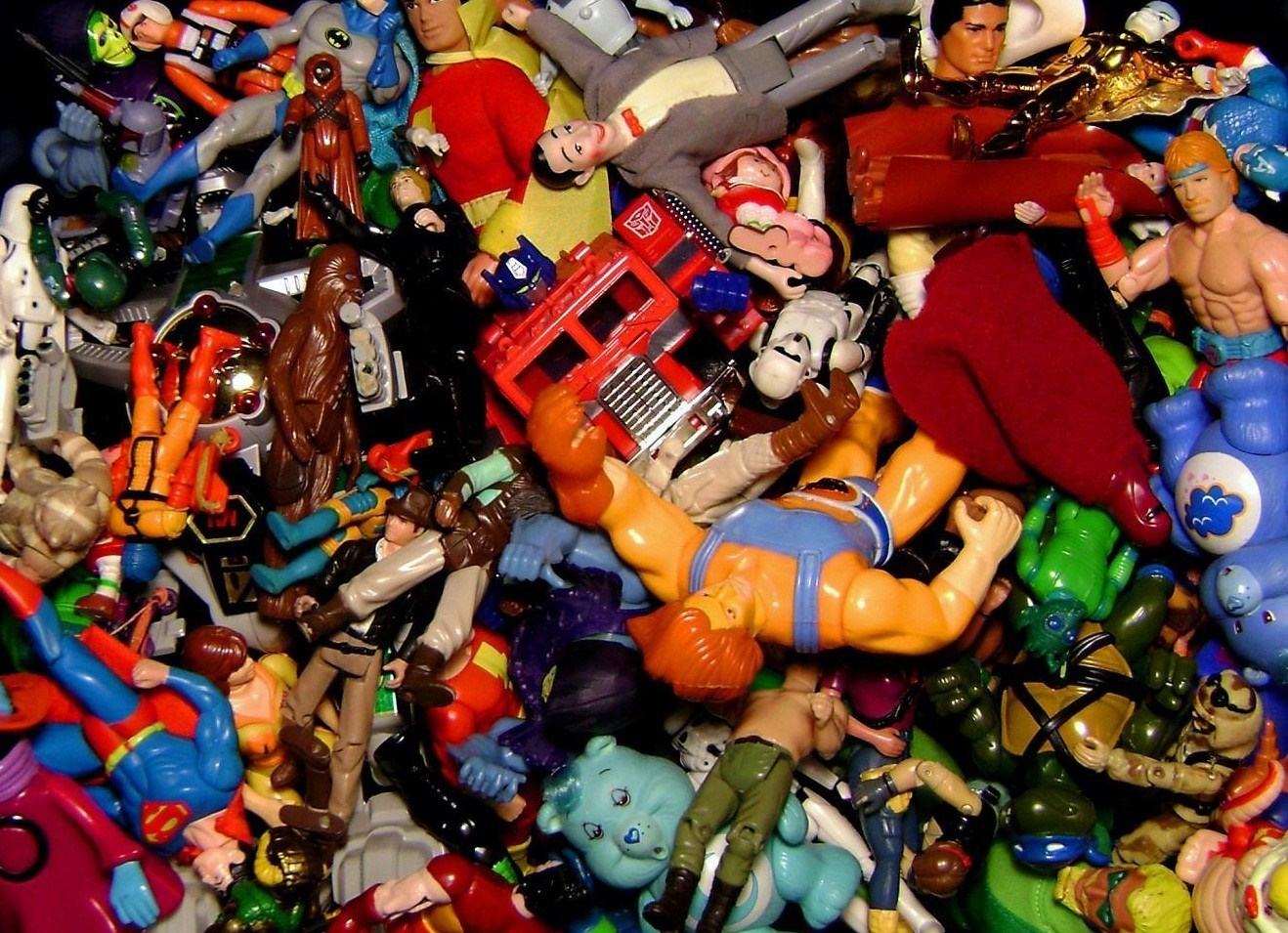 Collection of 1980s action figures including Star Wars, Transformers, and He-Man HD Wallpaper