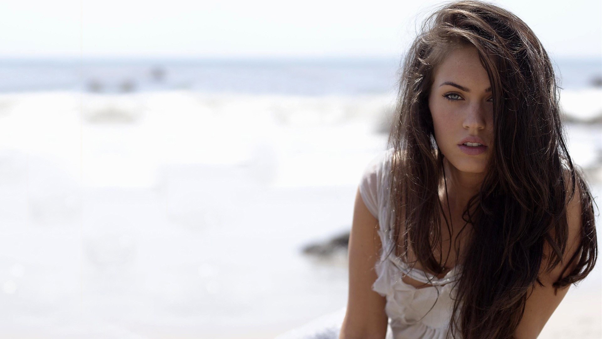 Megan Fox on a beach HD Wallpaper