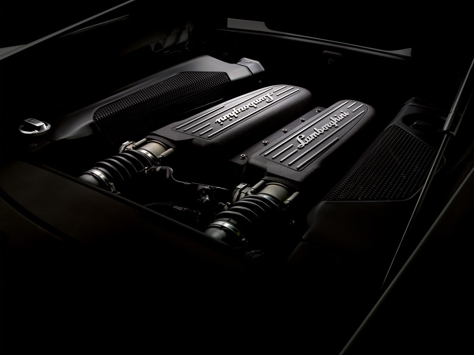 Lamborghini engine in a black sports car HD Wallpaper