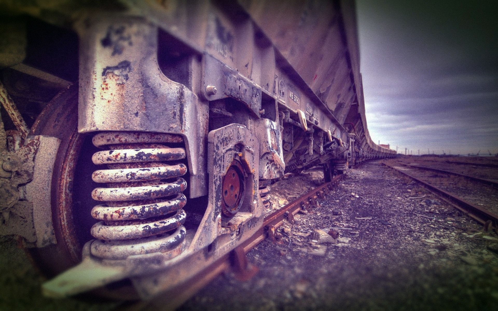 Close-up of a rusty train car on tracks HD Wallpaper