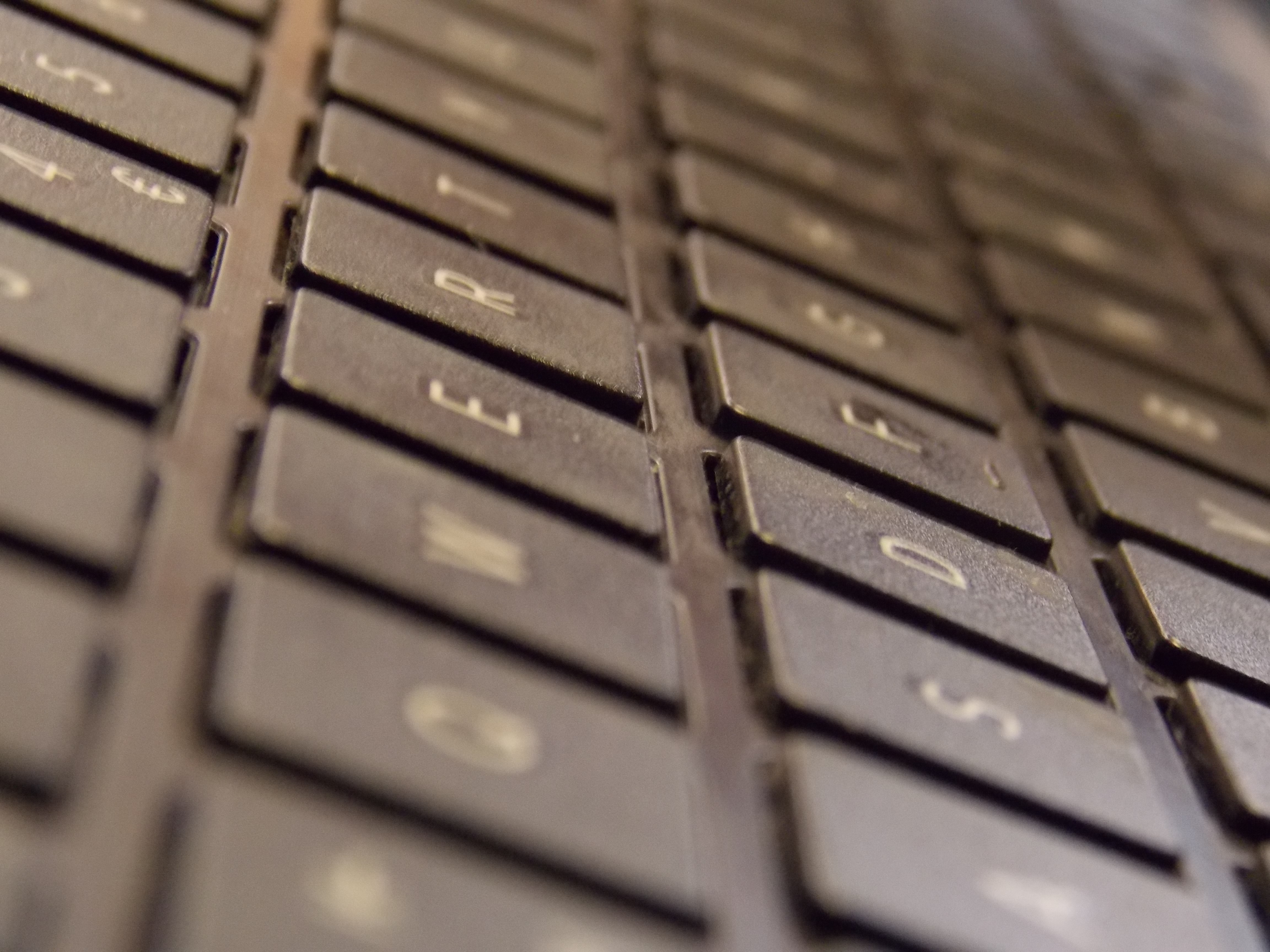 Close-up of a computer keyboard with visible keys HD Wallpaper