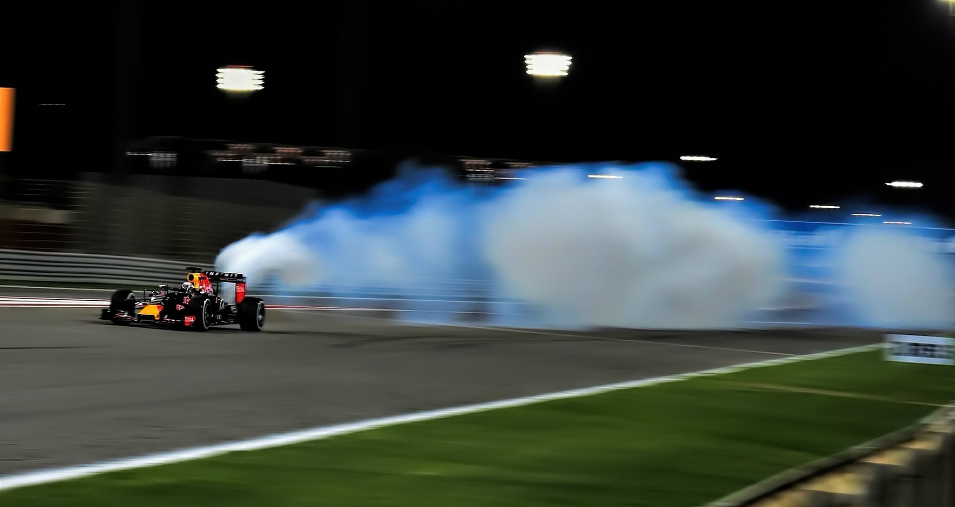 Red Bull Racing Formula 1 car drifting at night HD Wallpaper