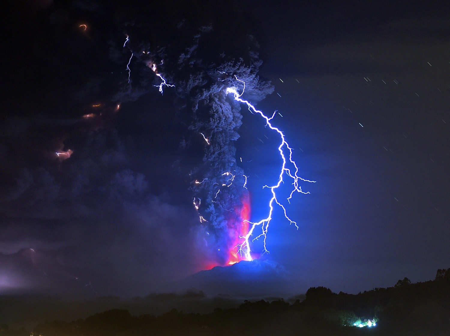Lightning strikes a volcano erupting at night HD Wallpaper