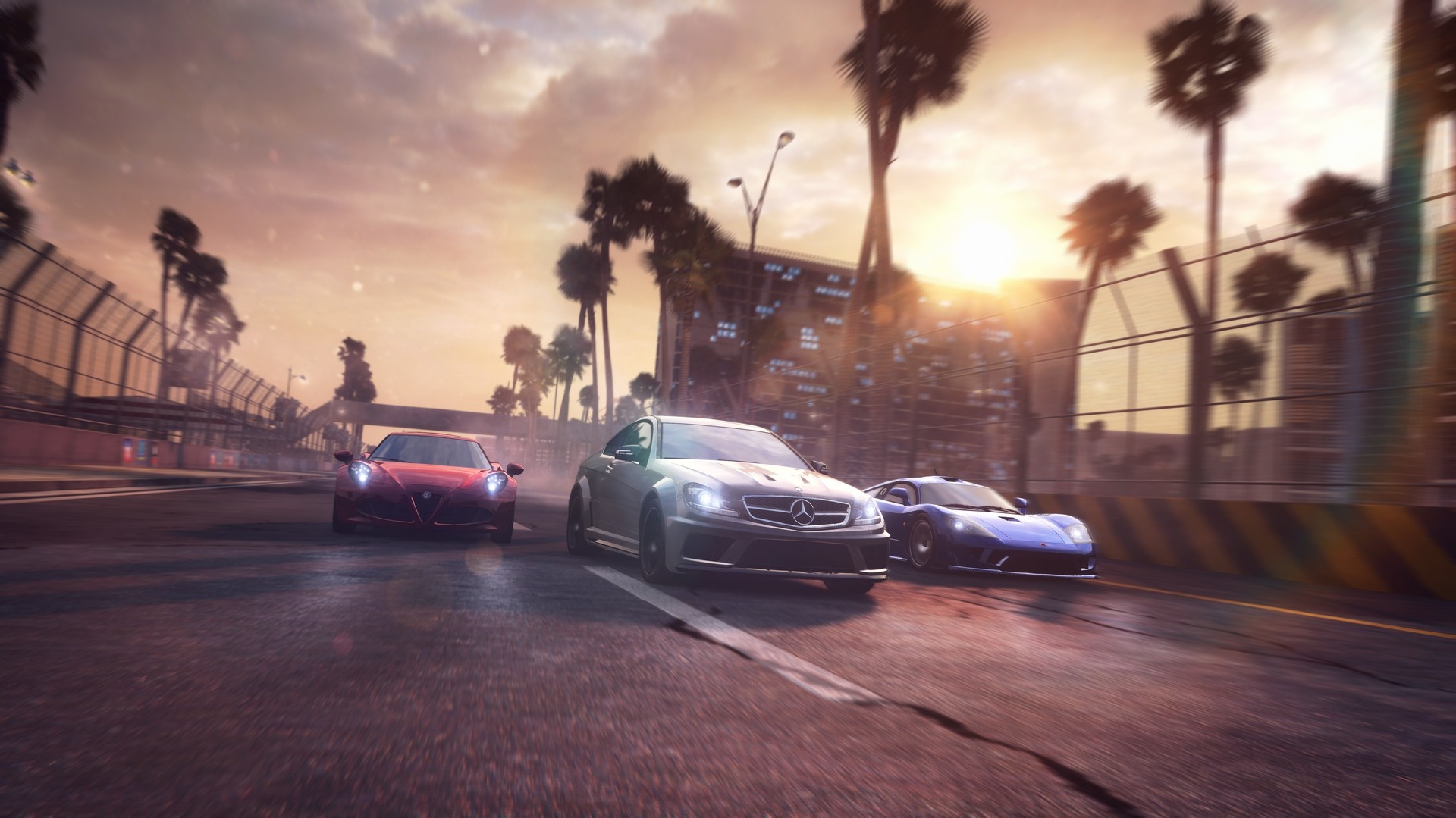 Three sports cars racing on a street circuit at sunset HD Wallpaper