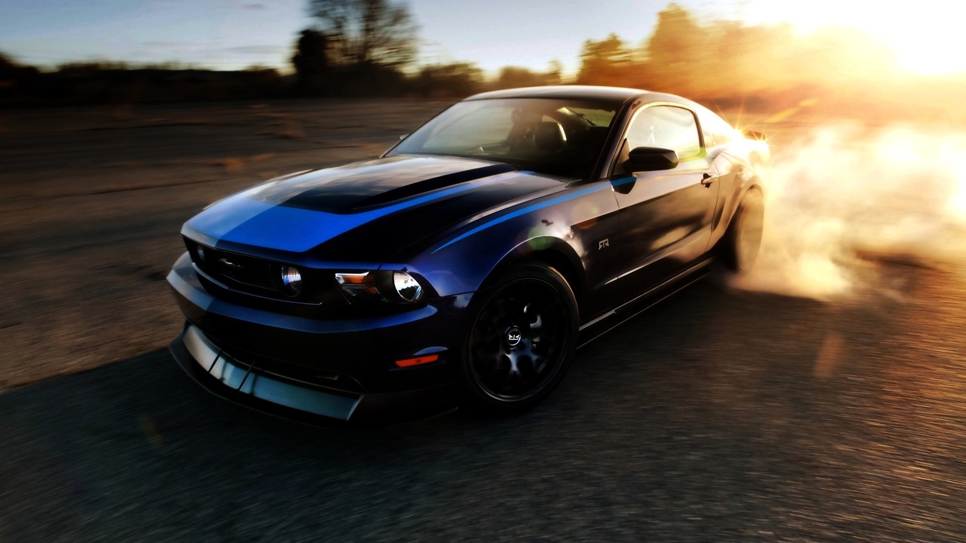 Ford Mustang performing a burnout with smoke HD Wallpaper
