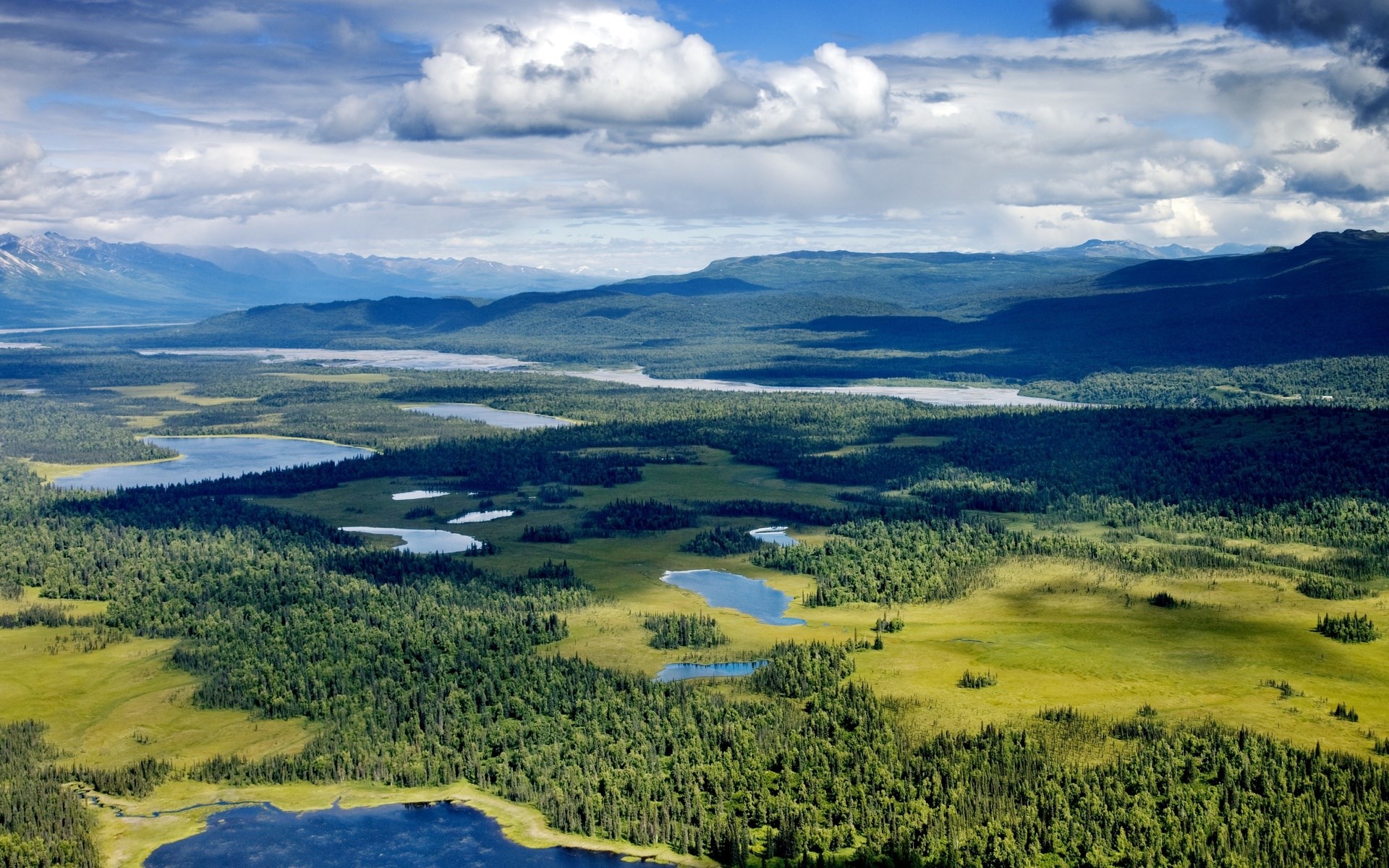 Aerial view of Alaskan wilderness with lakes and mountains HD Wallpaper
