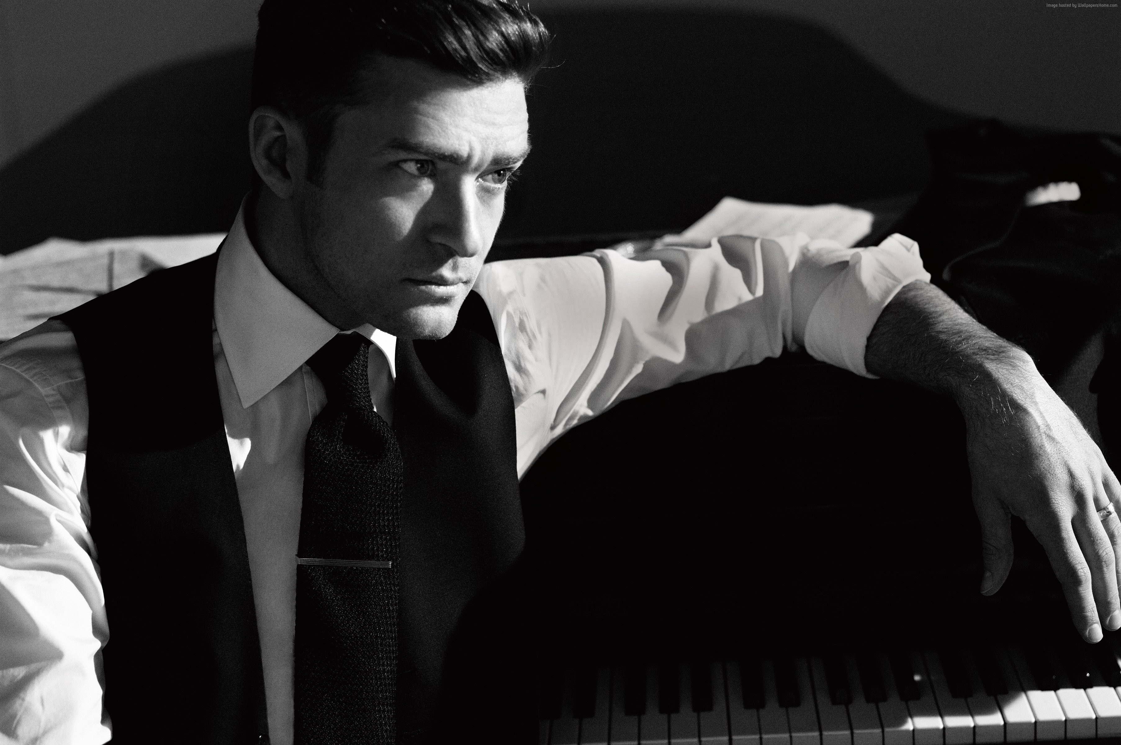 Justin Timberlake in a vest and tie by a piano HD Wallpaper