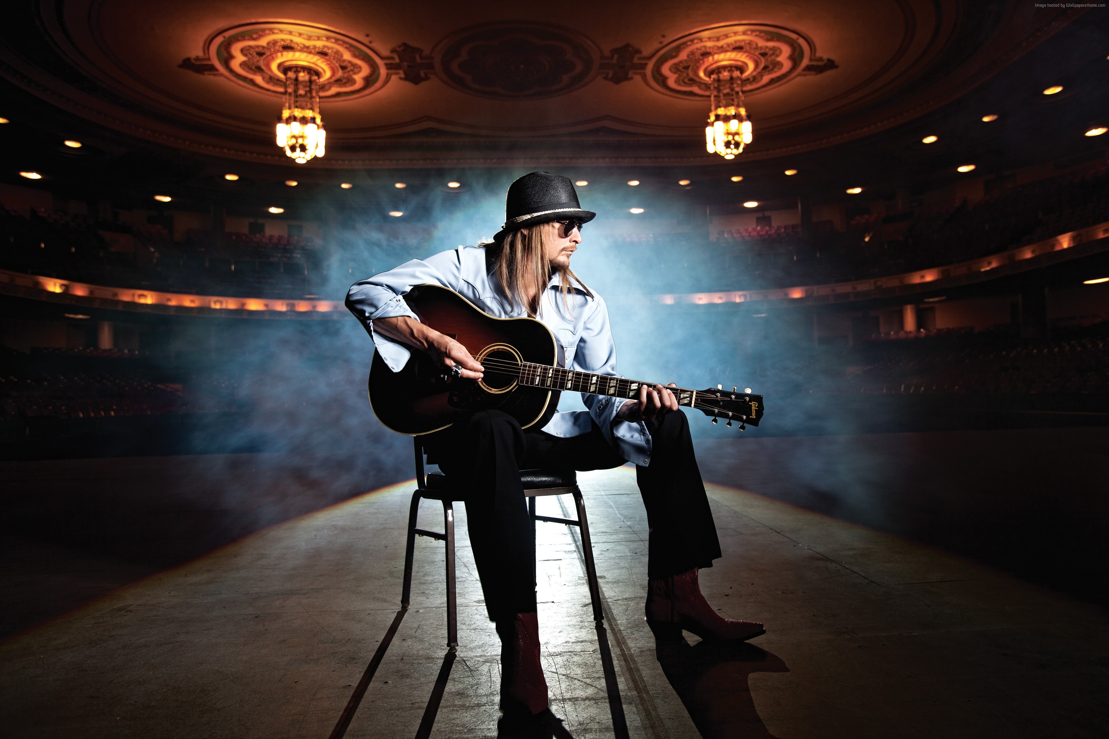 Kid Rock playing guitar on stage in theater HD Wallpaper