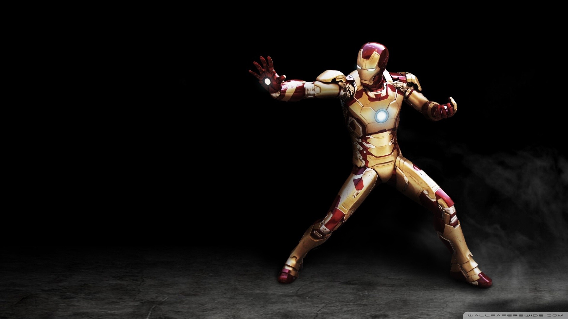 Iron Man action figure in a fighting pose HD Wallpaper