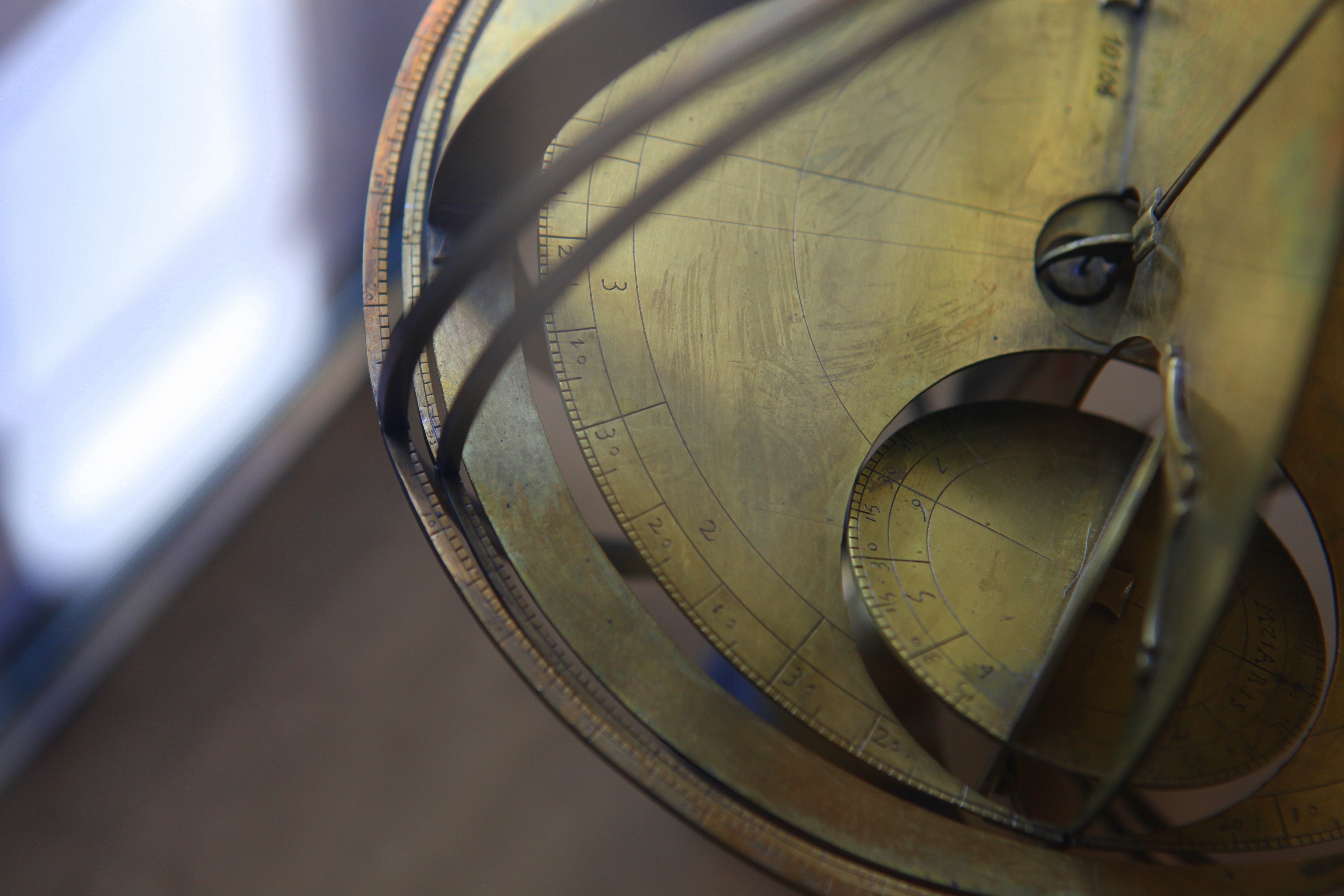 Close-up of an antique brass astrolabe HD Wallpaper