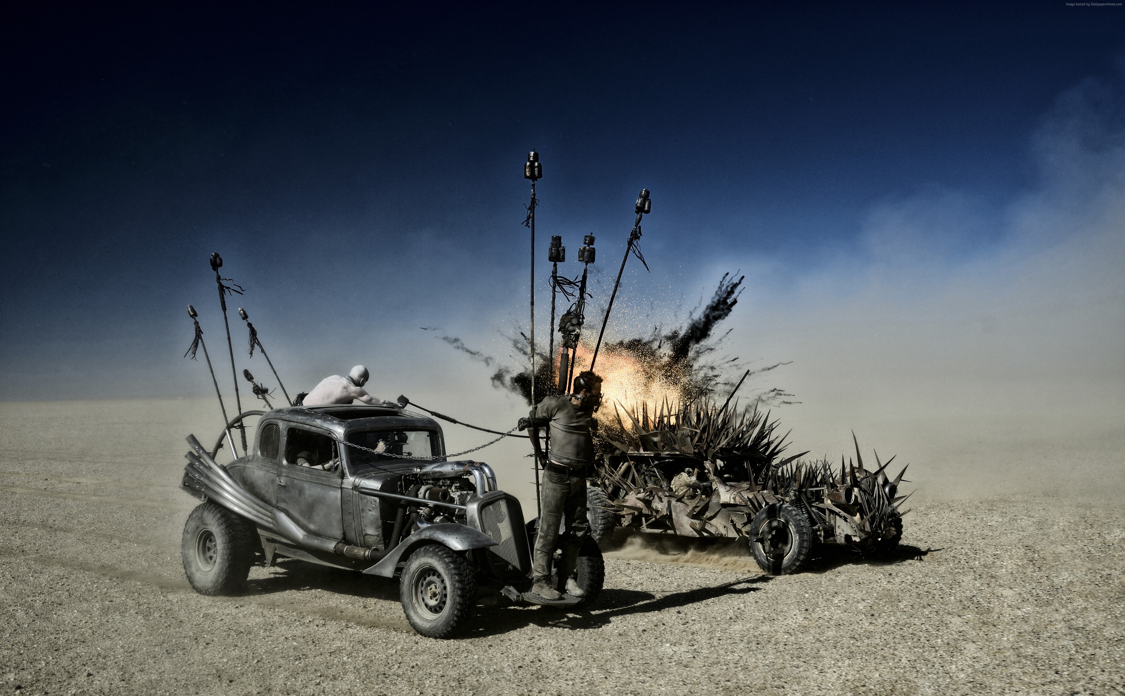 Mad Max: Fury Road - Two vehicles in a desert explosion HD Wallpaper